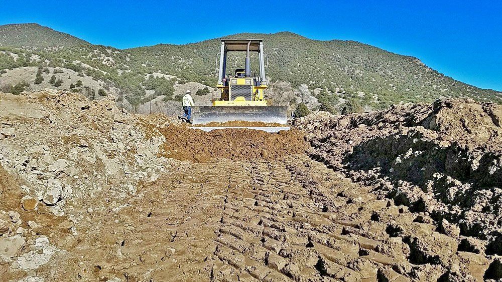 Moving dirt and evening ground for a building project