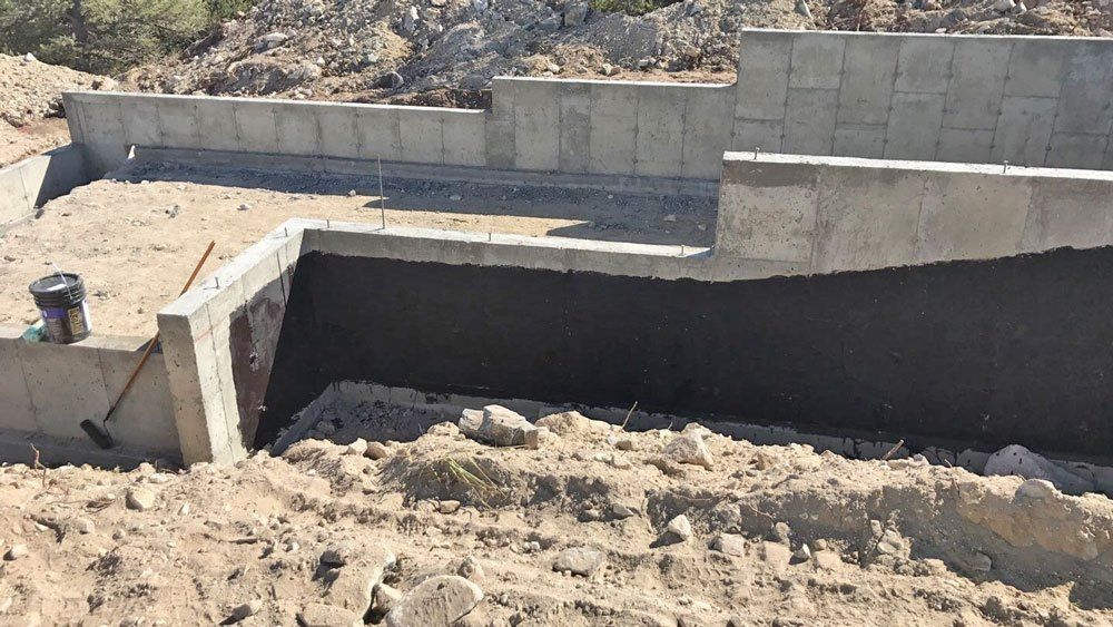 Concrete foundation bing tarred