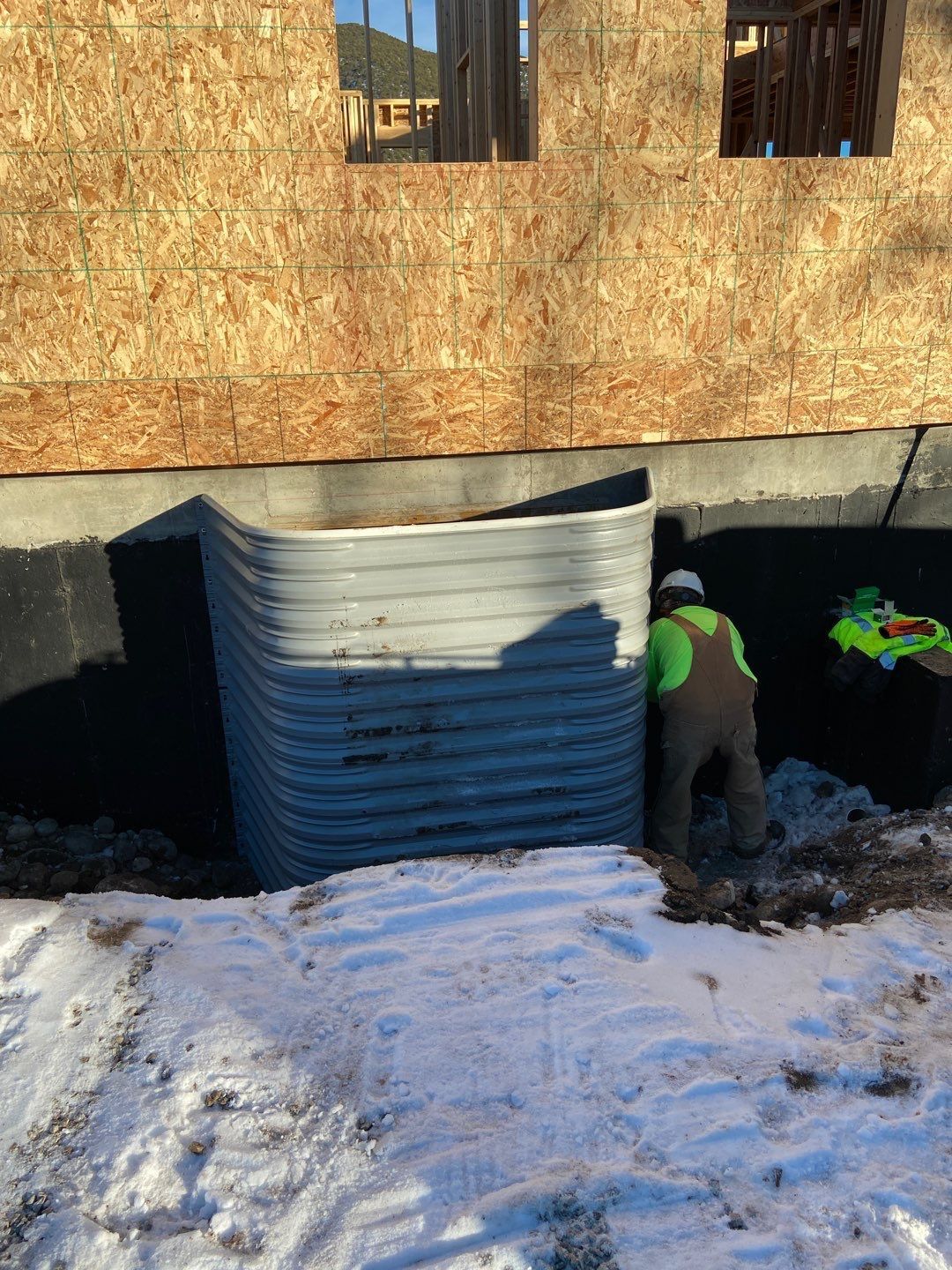 Worker near foundation