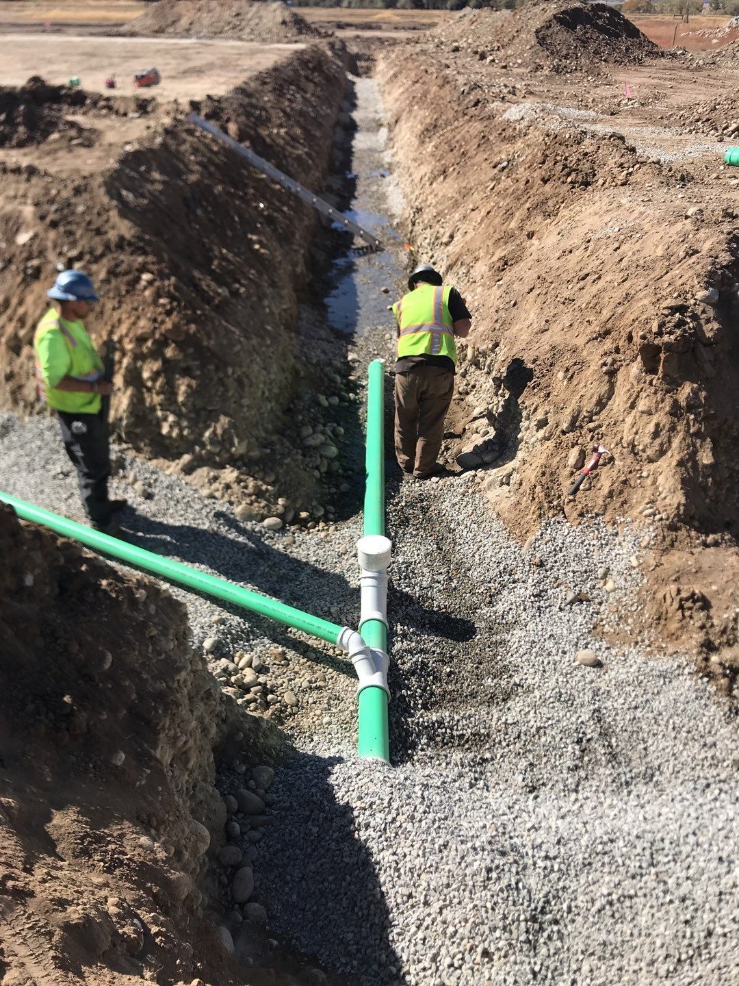 Gravel being laid around pipe Installation