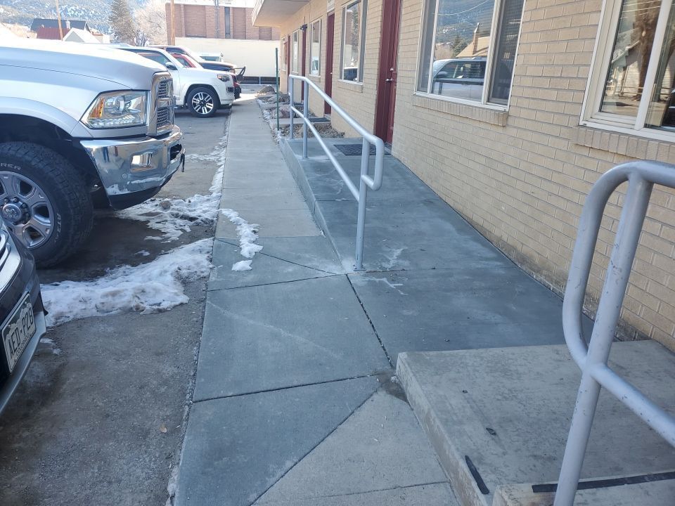 ADA access New concrete finished project with handrails