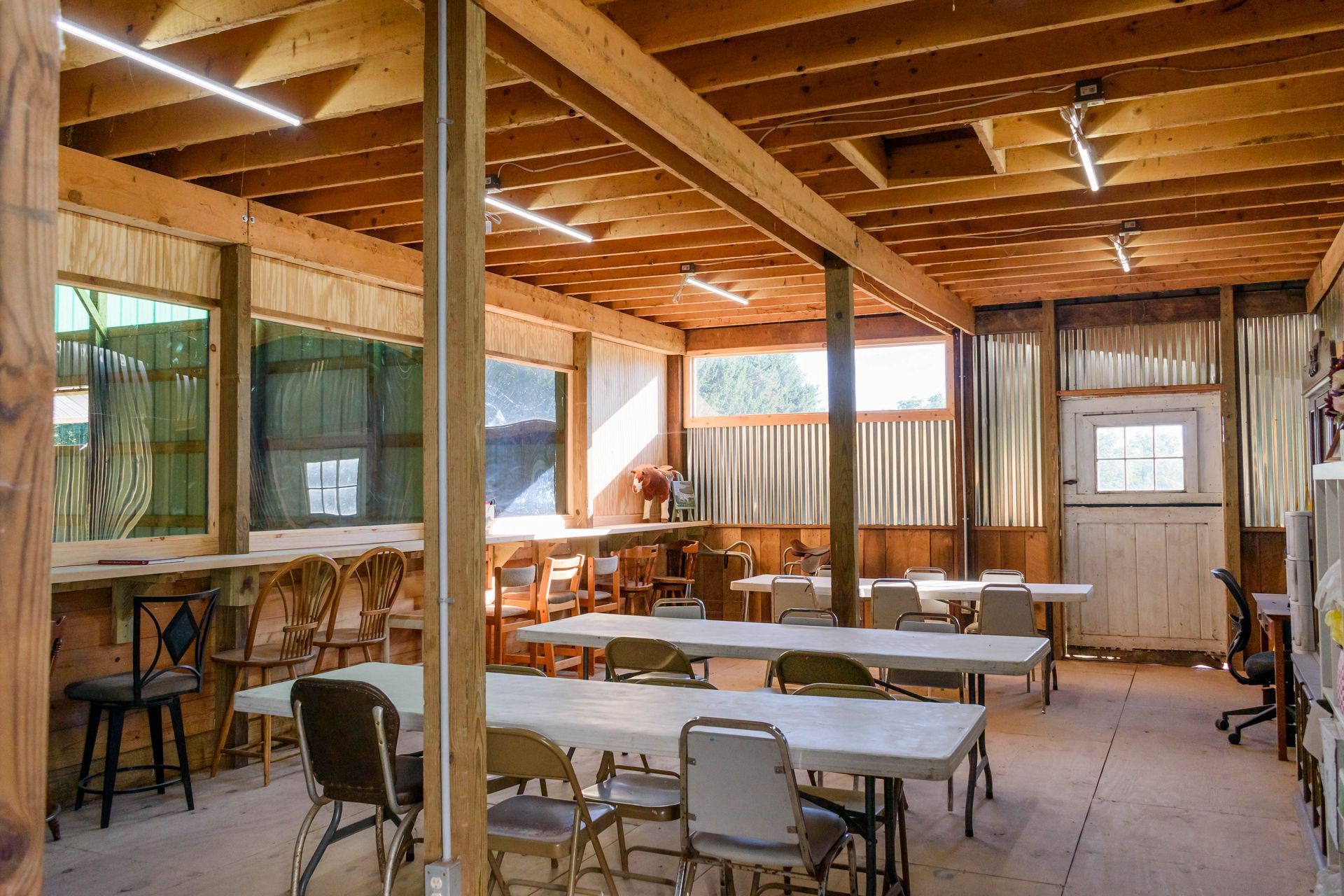 A large room with tables and chairs in it