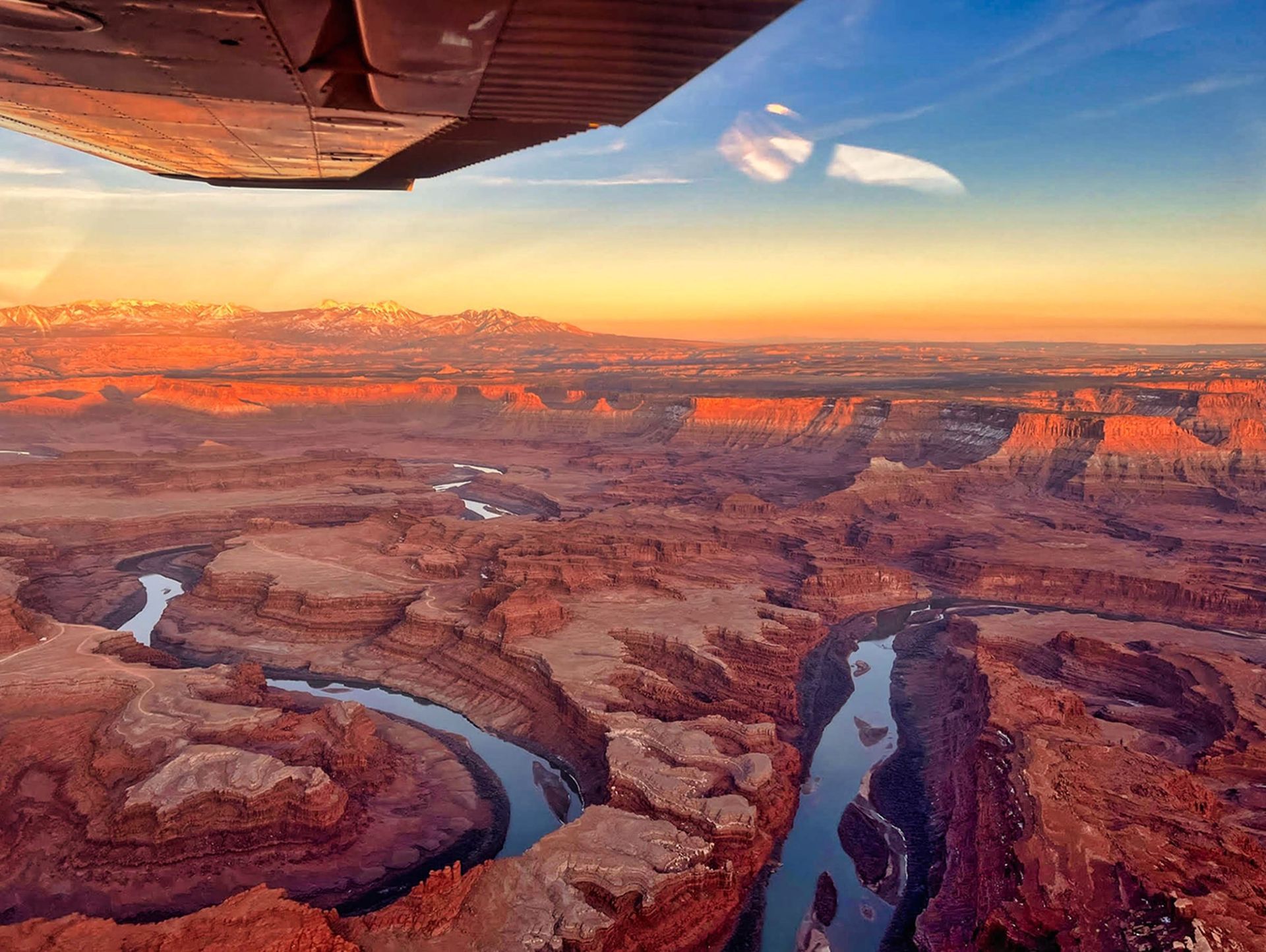 Aerial view of Canyonlands National Park at sunset, showing the Colorado River.