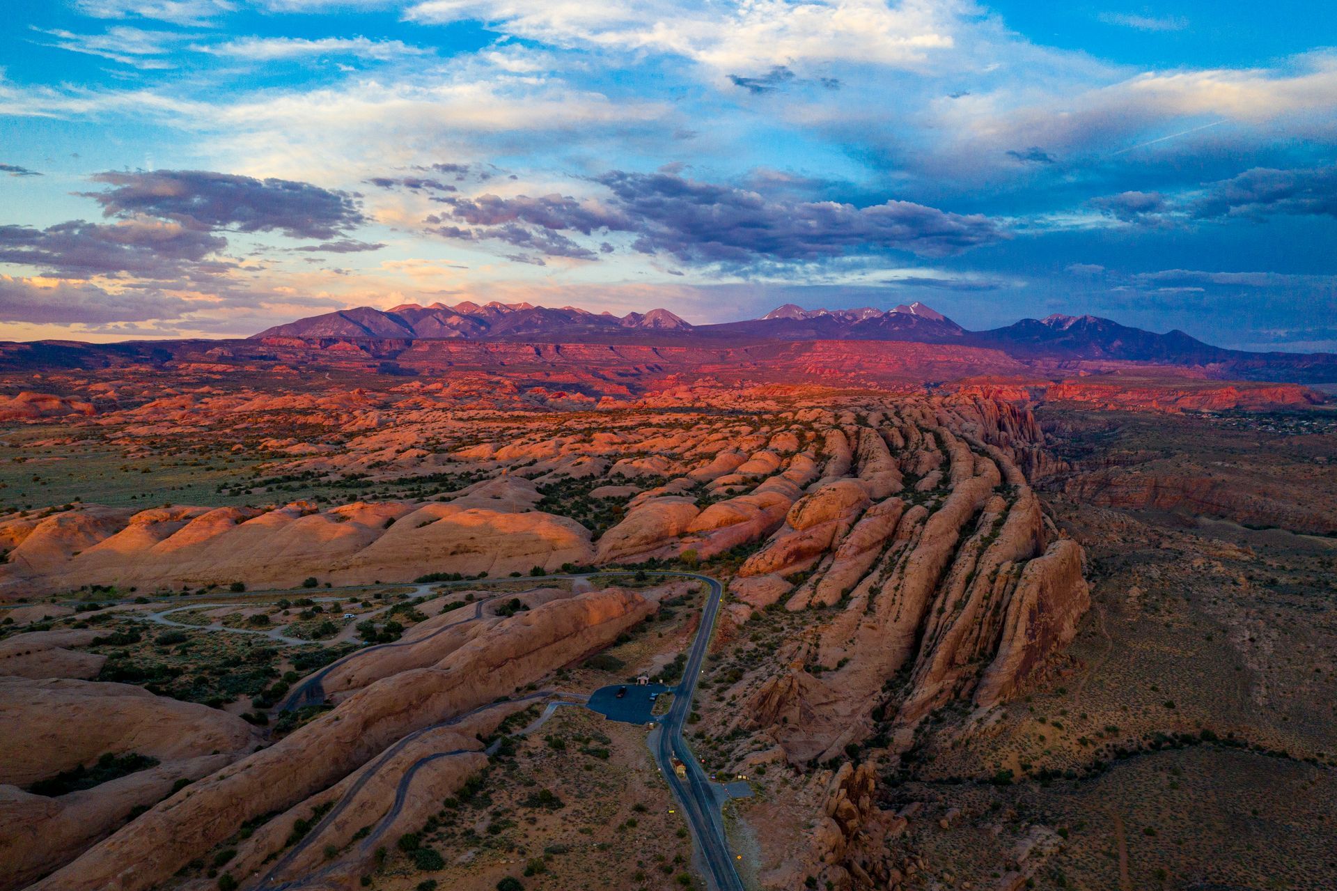 Sandstone fins of the Sanflats Recreation Area with a campground loop road visible.
