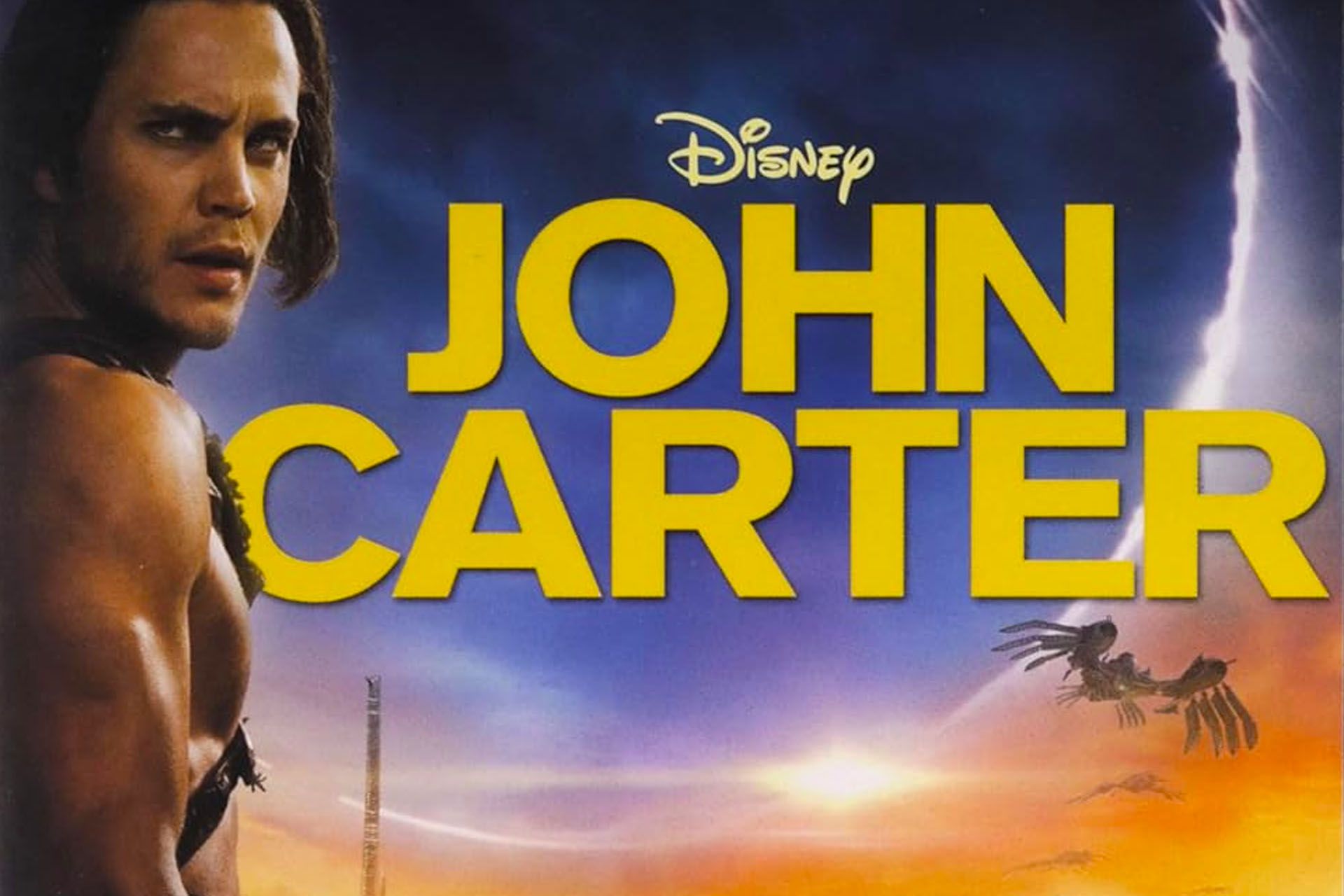 John Carter movie poster, man in foreground, yellow text, alien landscape background.