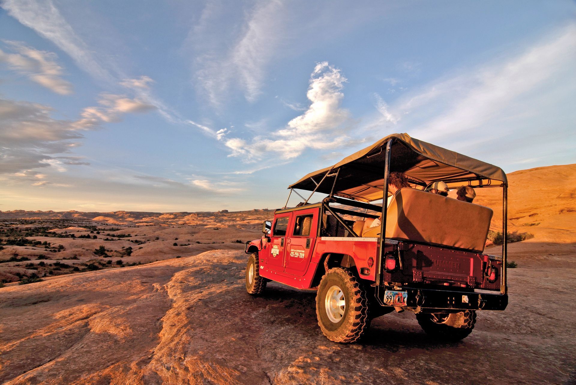 A Moab Adventure Center Hummer overlooks the Slickrock Mesa in Moab.