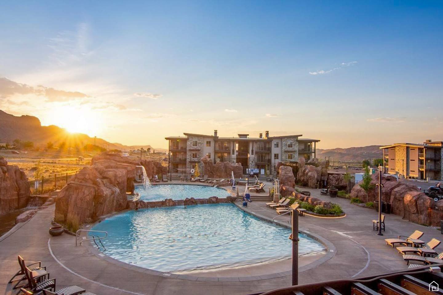 Pool at a vacation rental area with sunset.