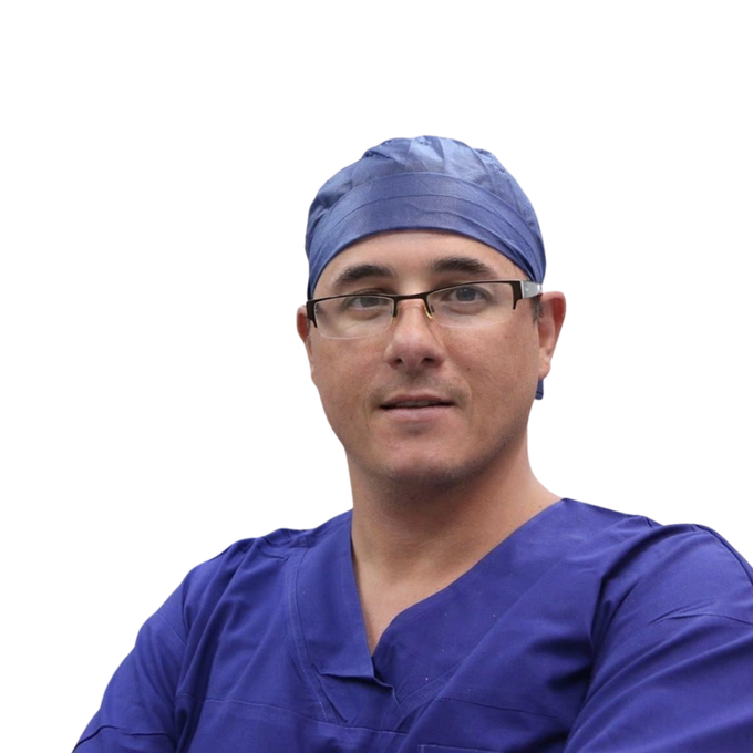 A man wearing glasses and a blue scrub hat