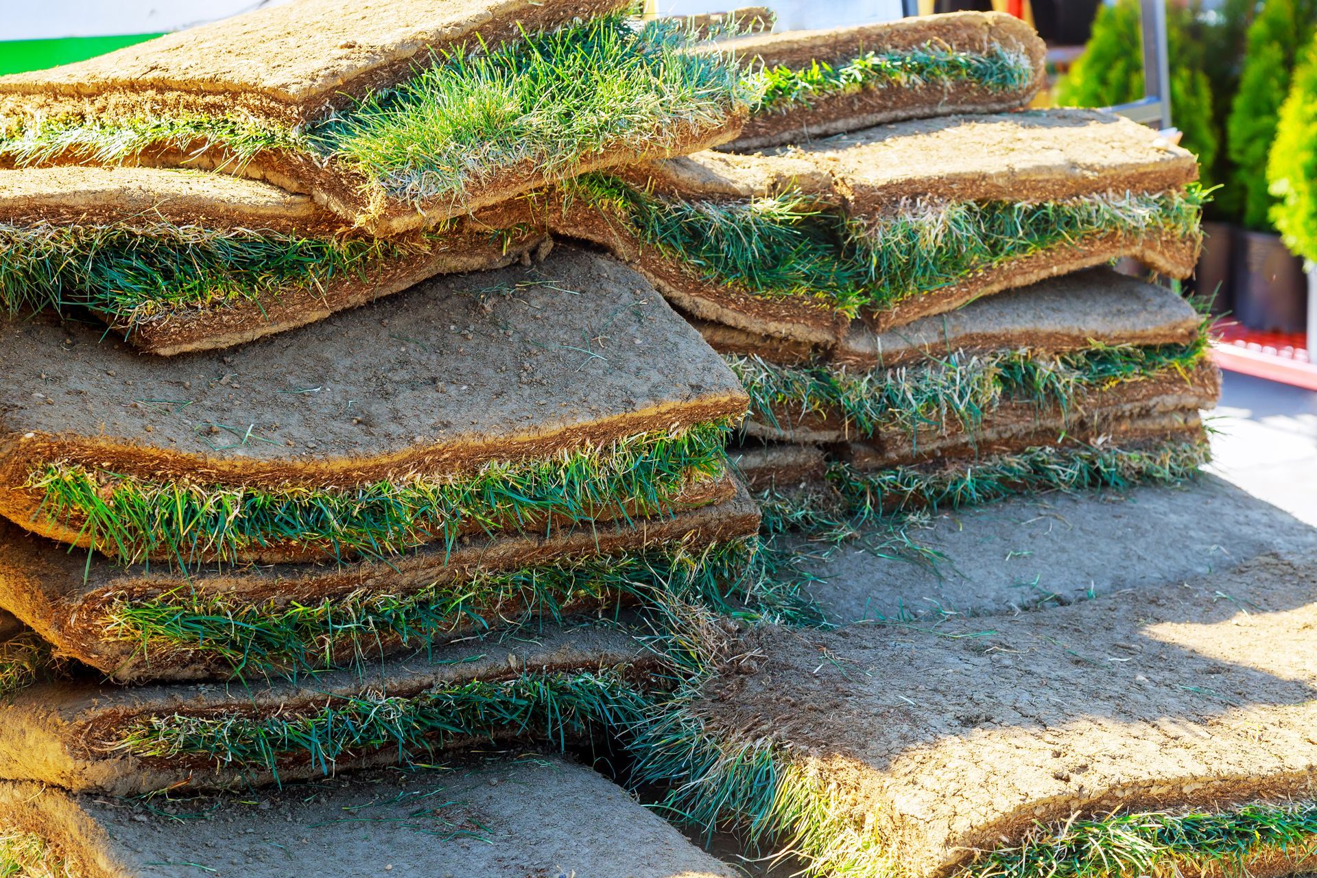 a pile of rolls of turf sitting on top of each other