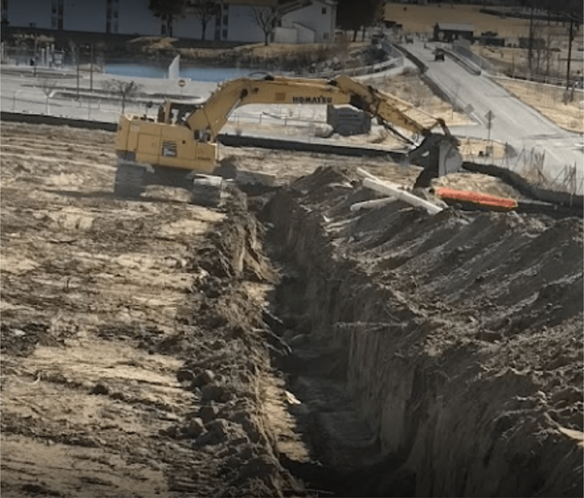Excavator conducting earthmoving operations.