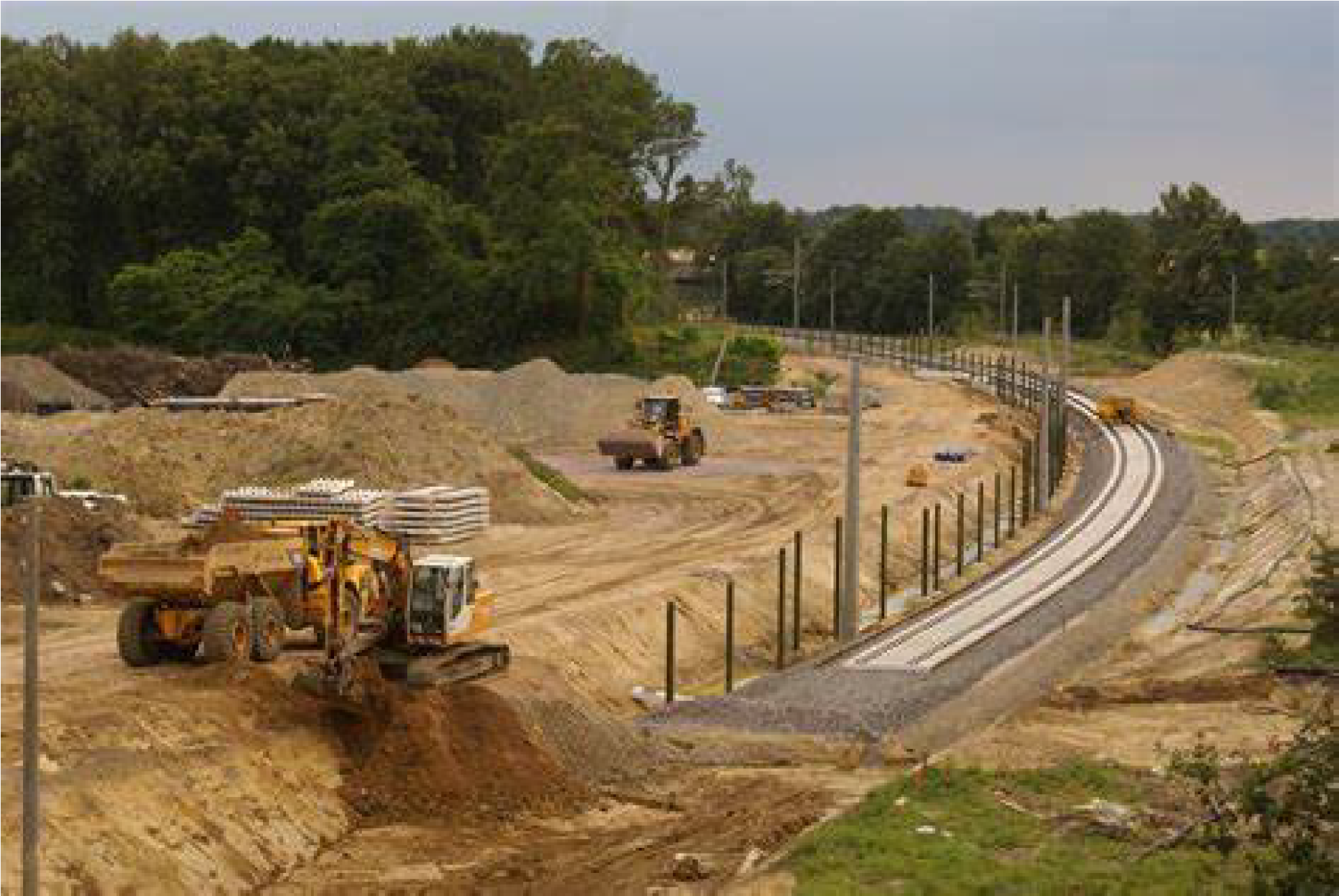 Heavy equipment performing road construction.