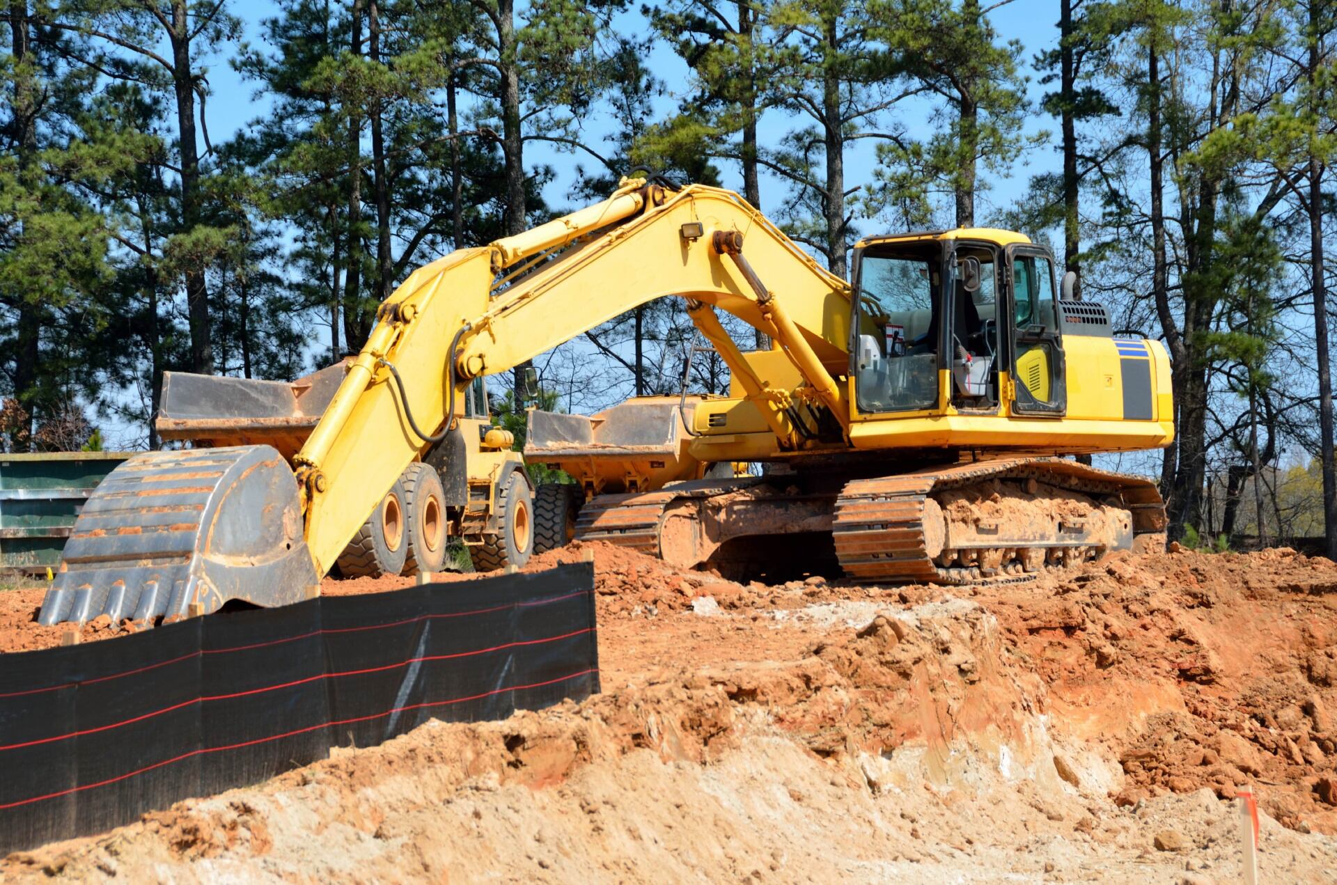 An excavator digging into the earth.