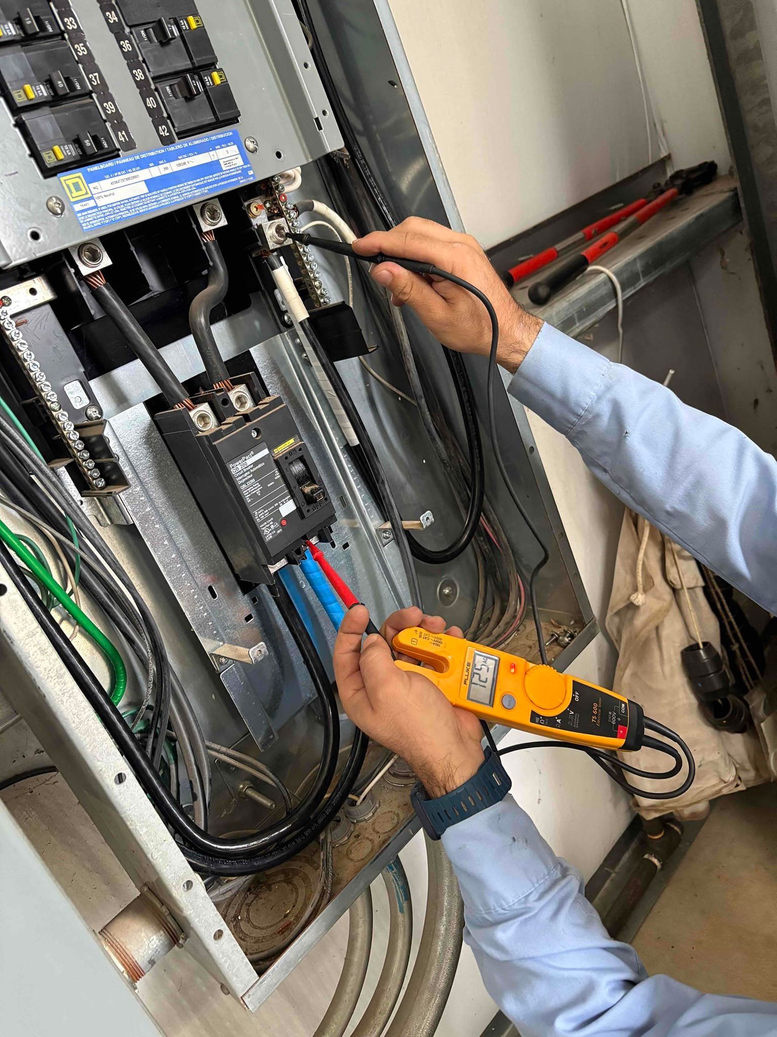Two electrical wires are connected to each other with lightning coming out of them