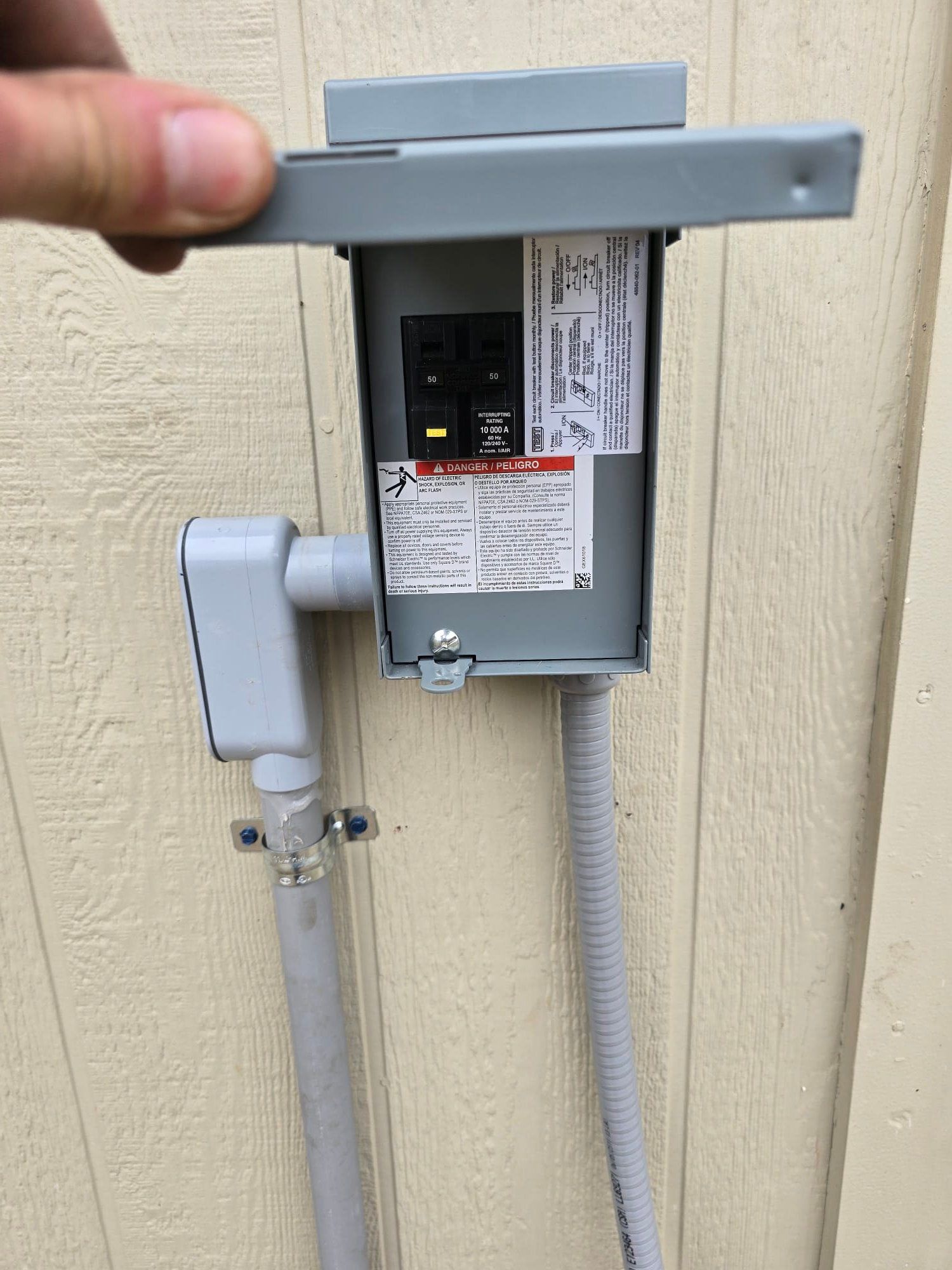 An aerial view of a large swimming pool with people swimming in it.