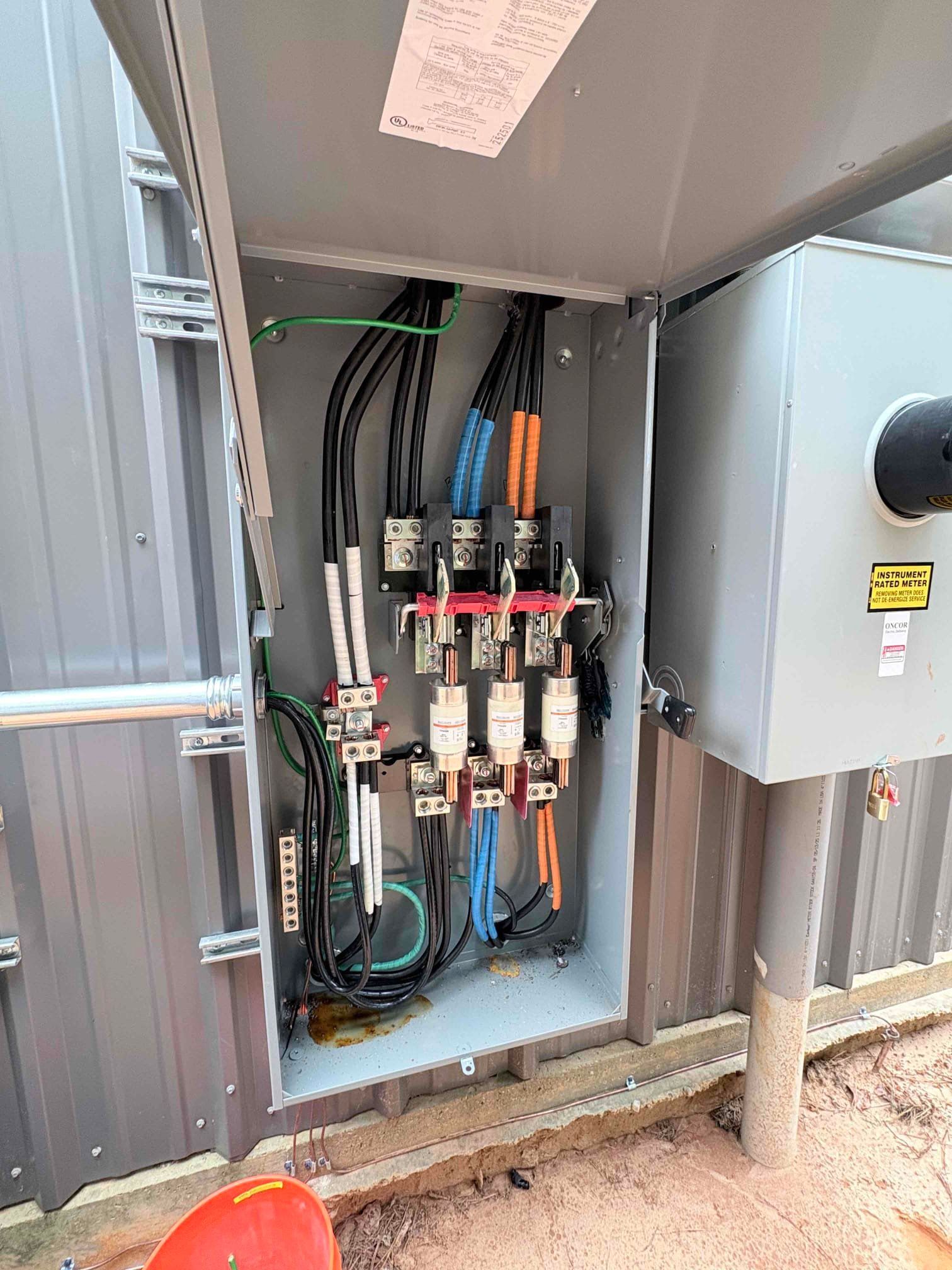 A man is installing a light fixture in a kitchen.