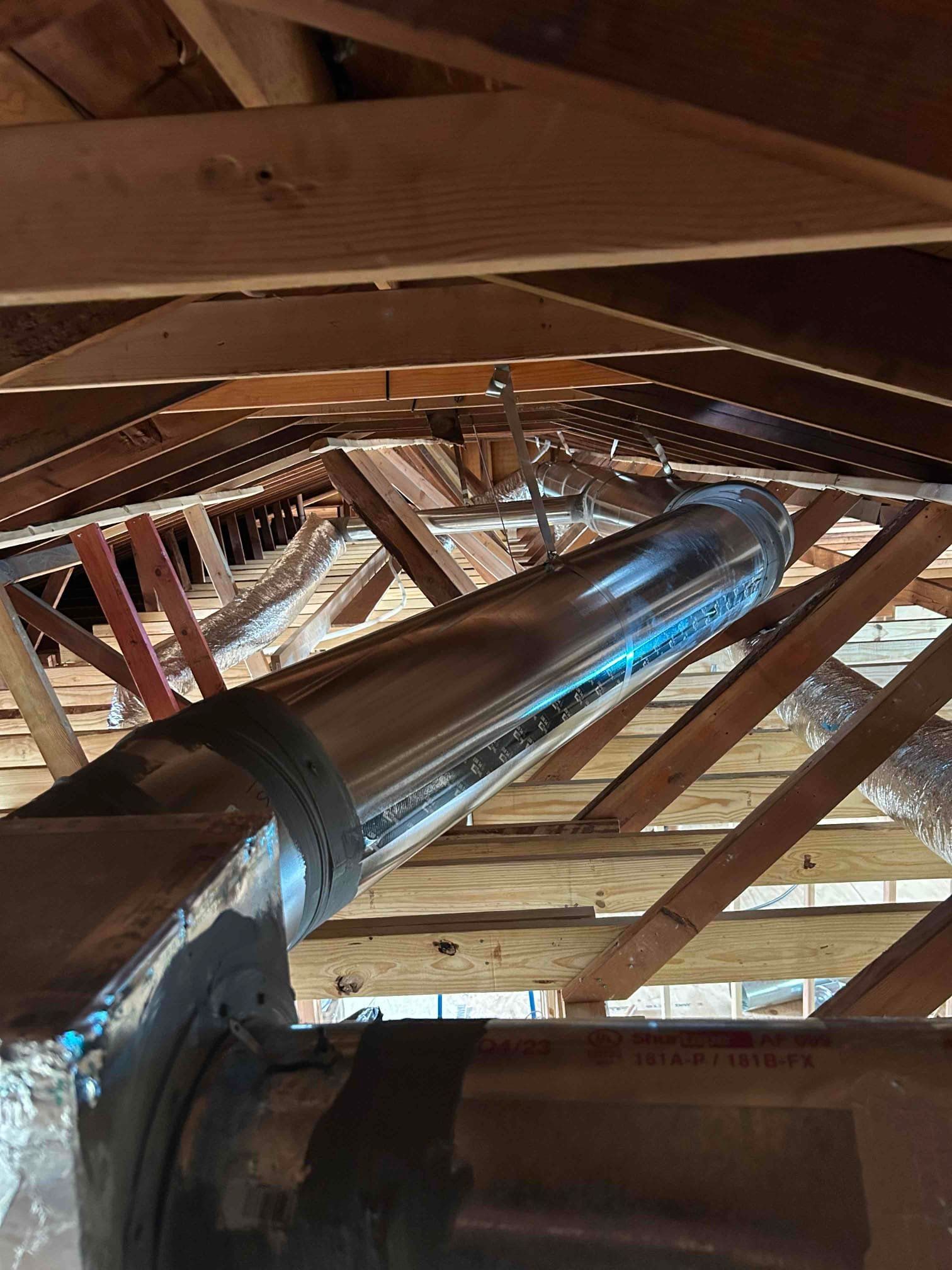 A person is cutting a duct with a pair of scissors.