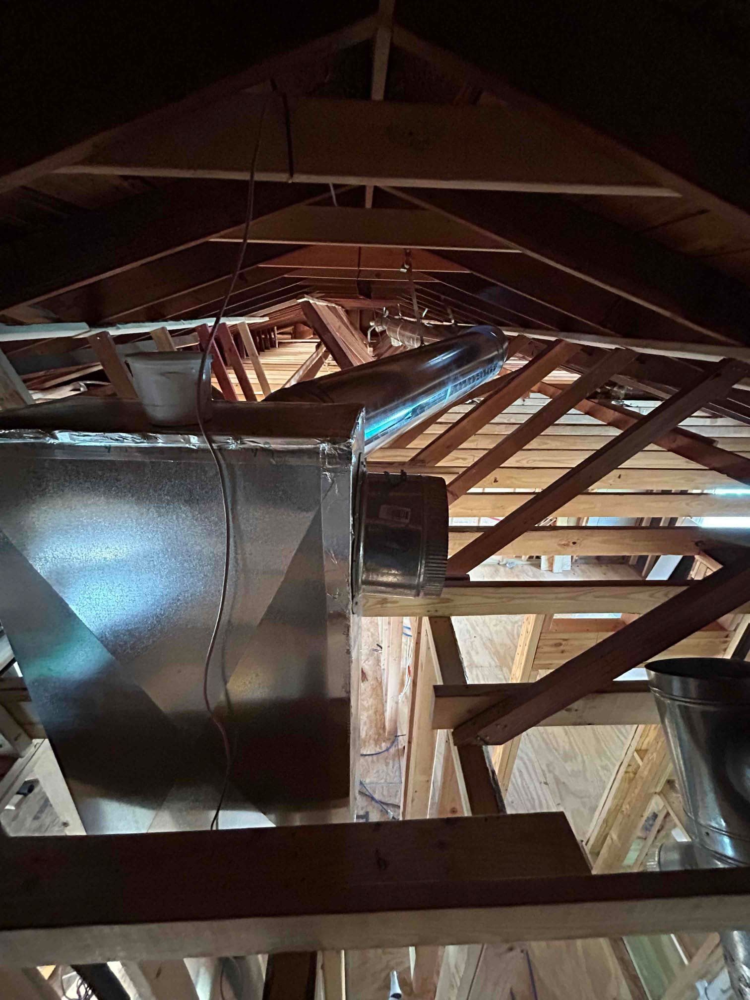 An air conditioner is sitting outside of a brick building.