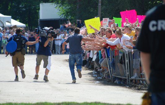 A man in a black shirt with the letter cr on it