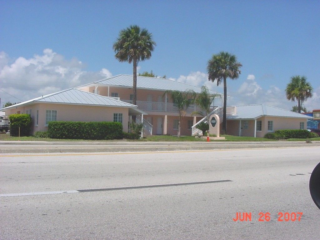 A for lease sign is in front of a house