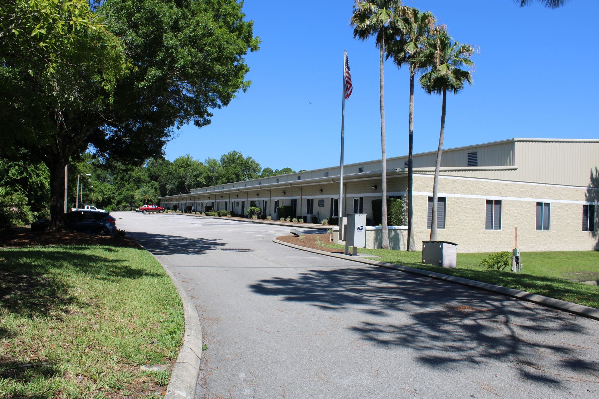 A large building with palm trees in front of it