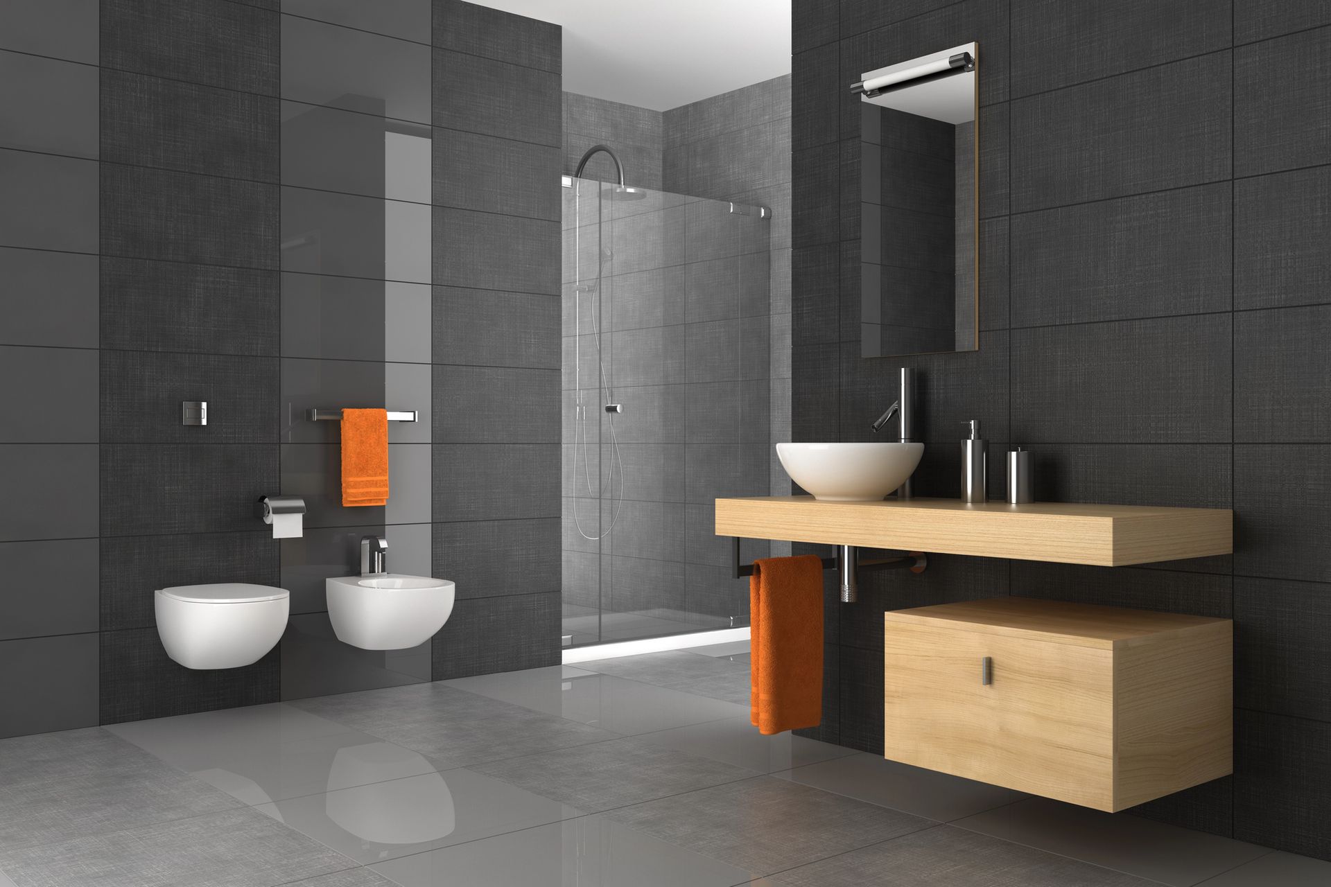 Moderno bagno grigio con mobiletto, lavandino e WC in legno, dettagli arancioni.
