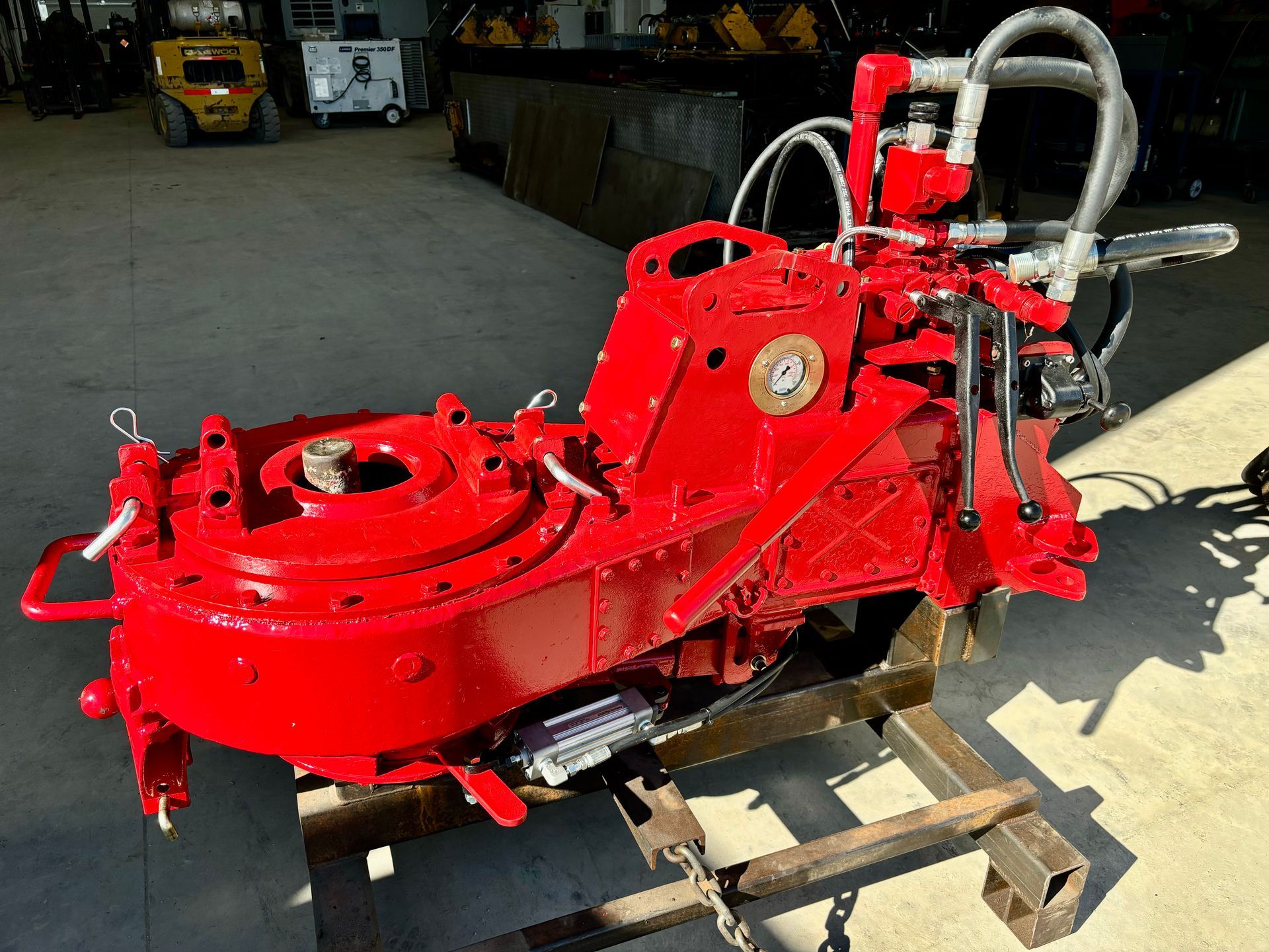 Two men holding a sign that says parkland hydraulics and mechanical