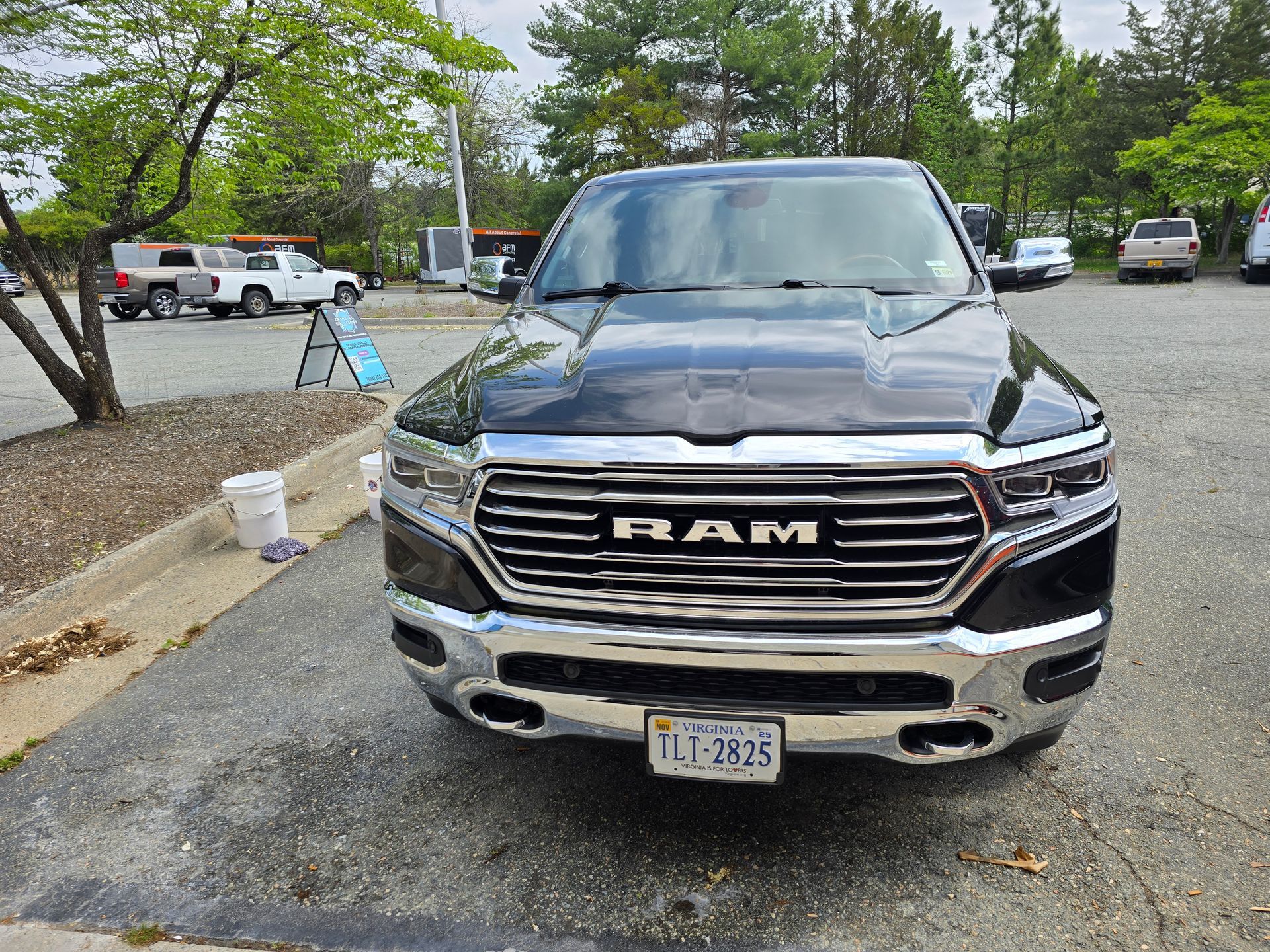 Black Ram pickup truck parked on asphalt.