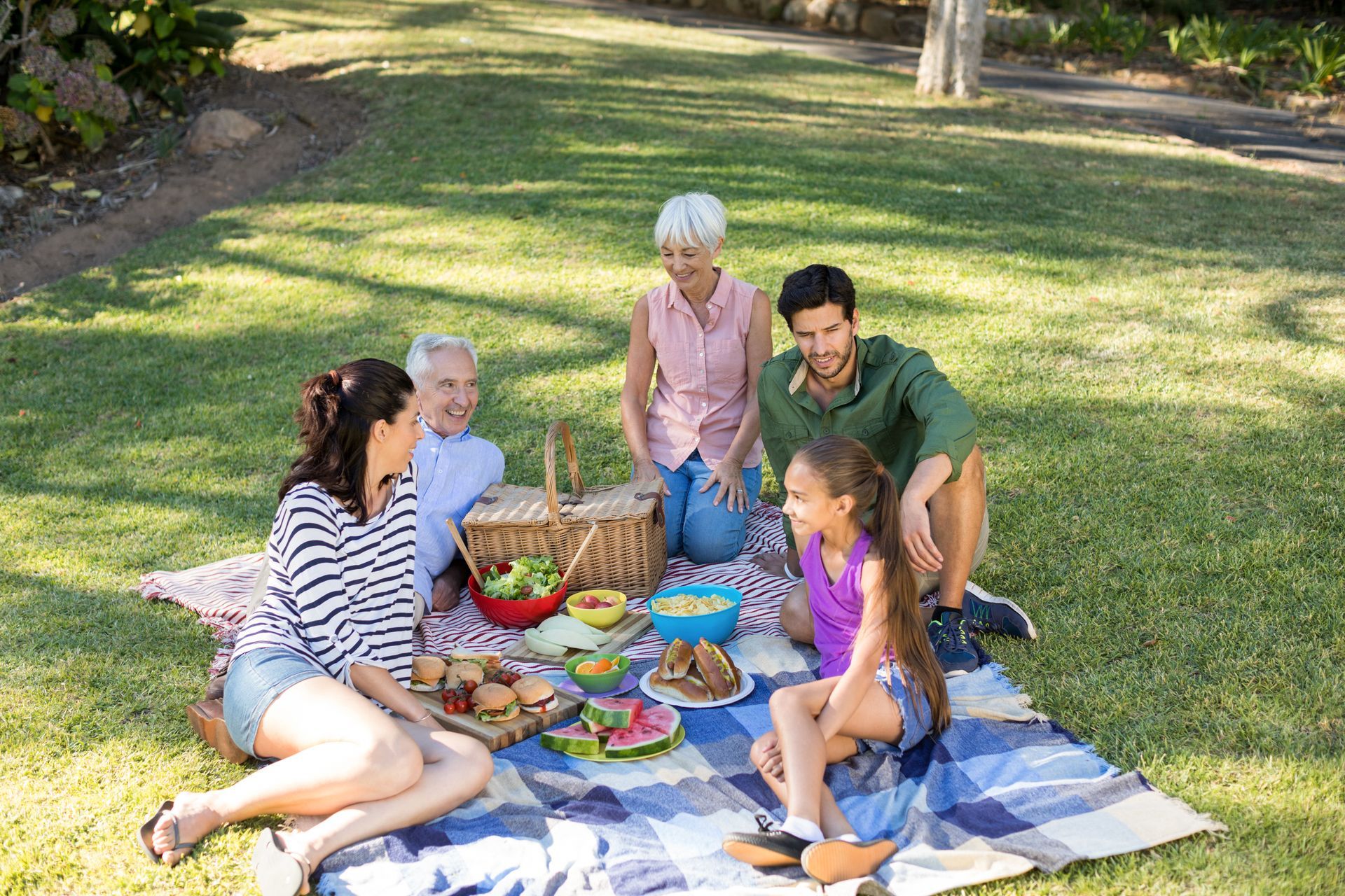 A family is having a picnic in the park.