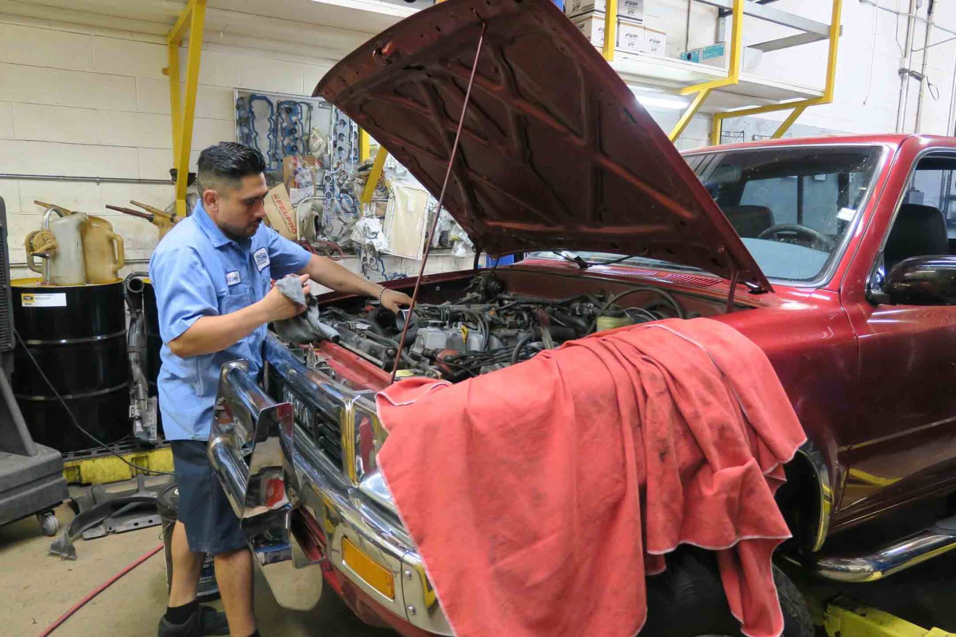 Mechanic — Employee Fixing Car Engine in Ontario, California