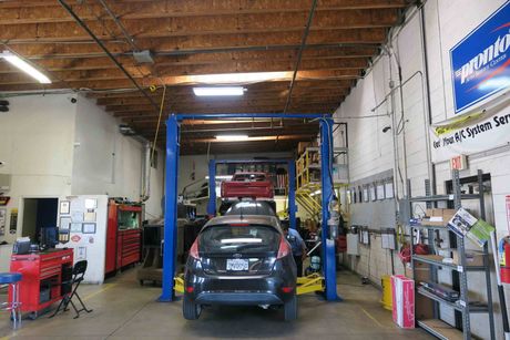 Oil Change — Car On Repair Garage in Ontario, California