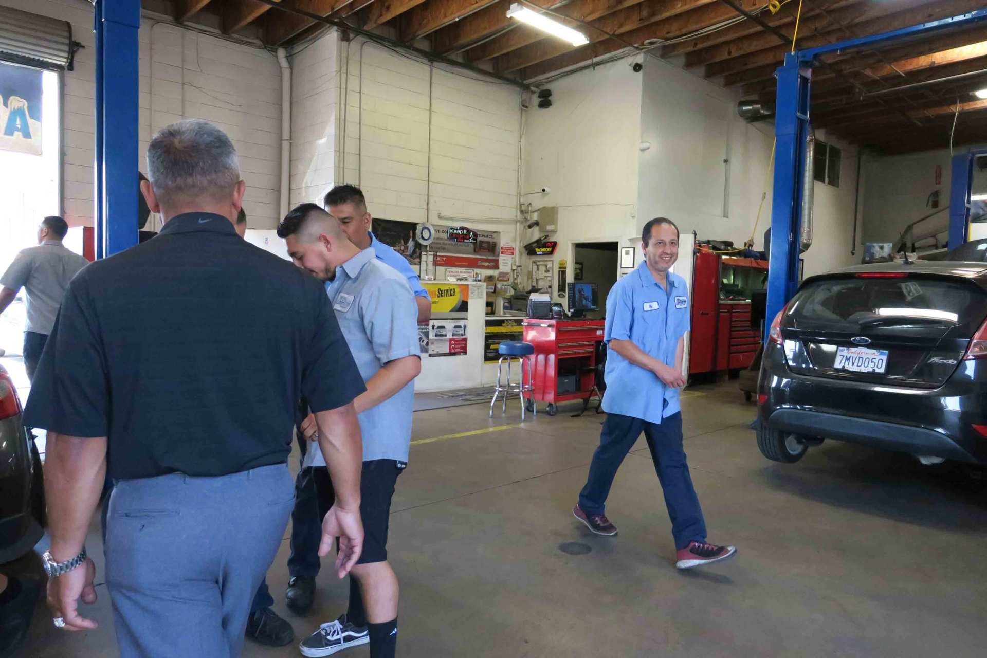 Tire Installation — Happy Employee In The Shop in Ontario, California