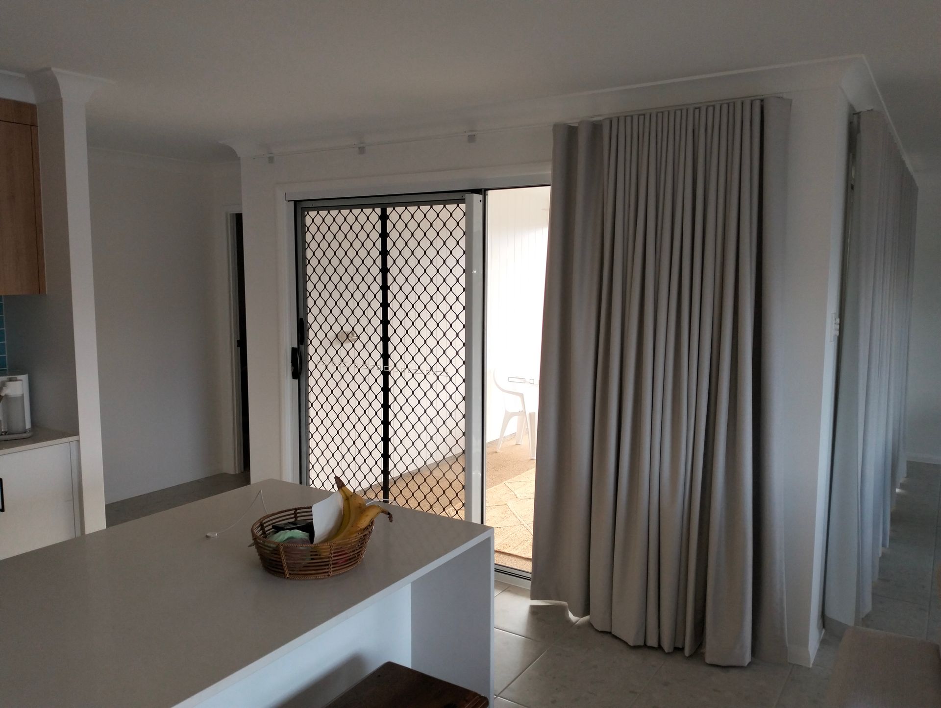 Exterior of a Modern White House With Large Windows — Seaview Blinds & Shutters in Woodbury, QLD