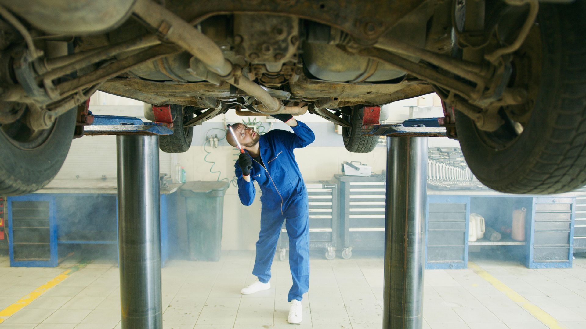 Mechanic Inspecting the car