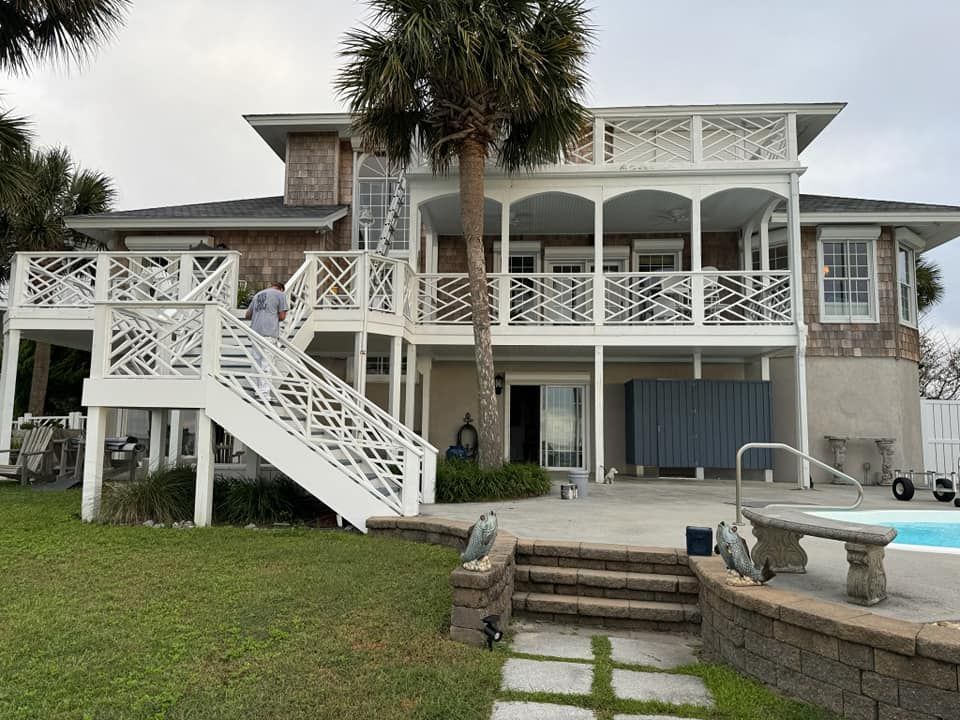 A large house with a swimming pool in the backyard.