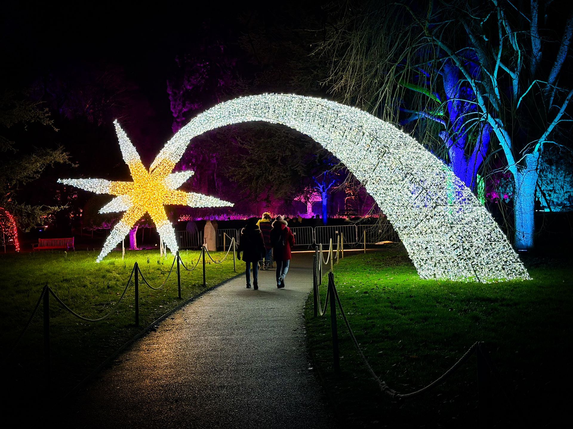 A very large fairy light shooting star at a Christmas light trail event