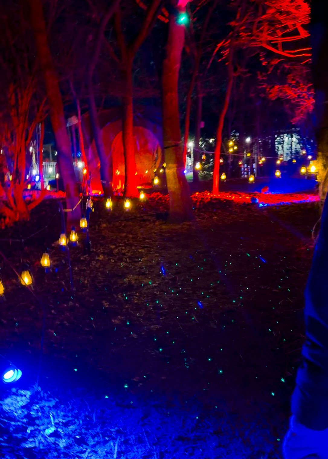 A dark walkway lit by mini mining lamps.