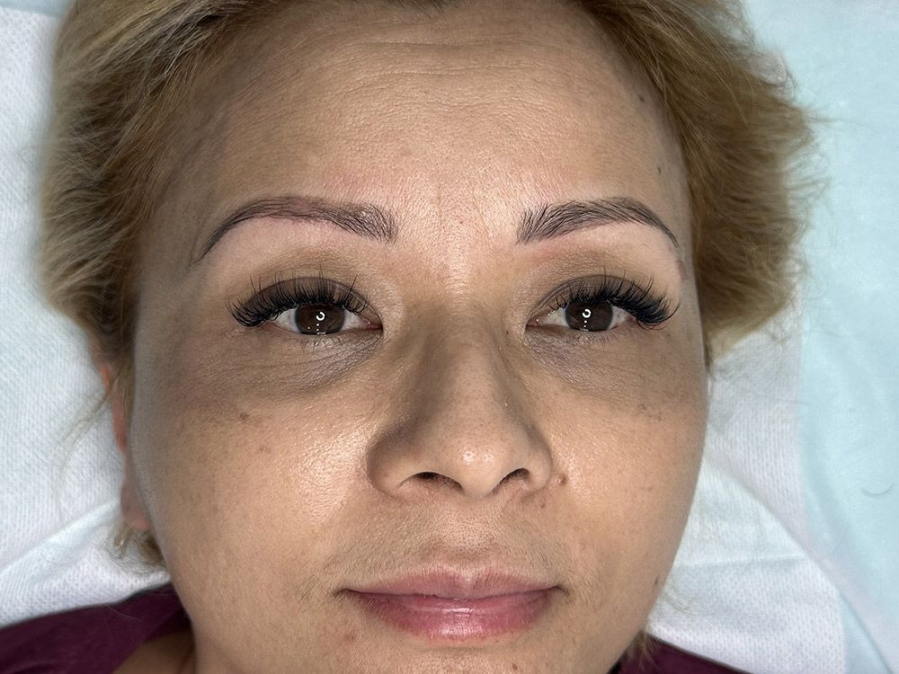 A Close up Of a Woman's Face with A Tattoo on Her Eyebrows — Brow & Lash Clinic In Cairns