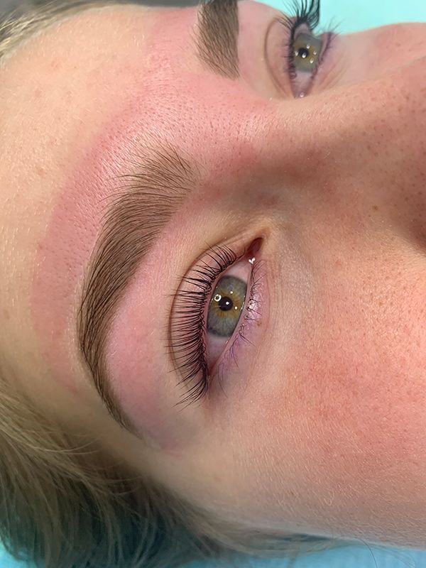 Woman's Face During Eyebrow Procedure — Brow & Lash Clinic In Cairns