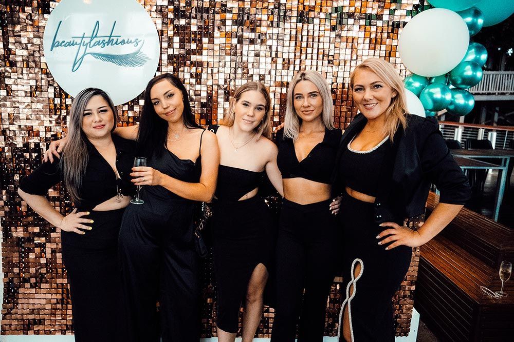 A Group of Women Are Posing for a Picture — Brow & Lash Clinic In Cairns