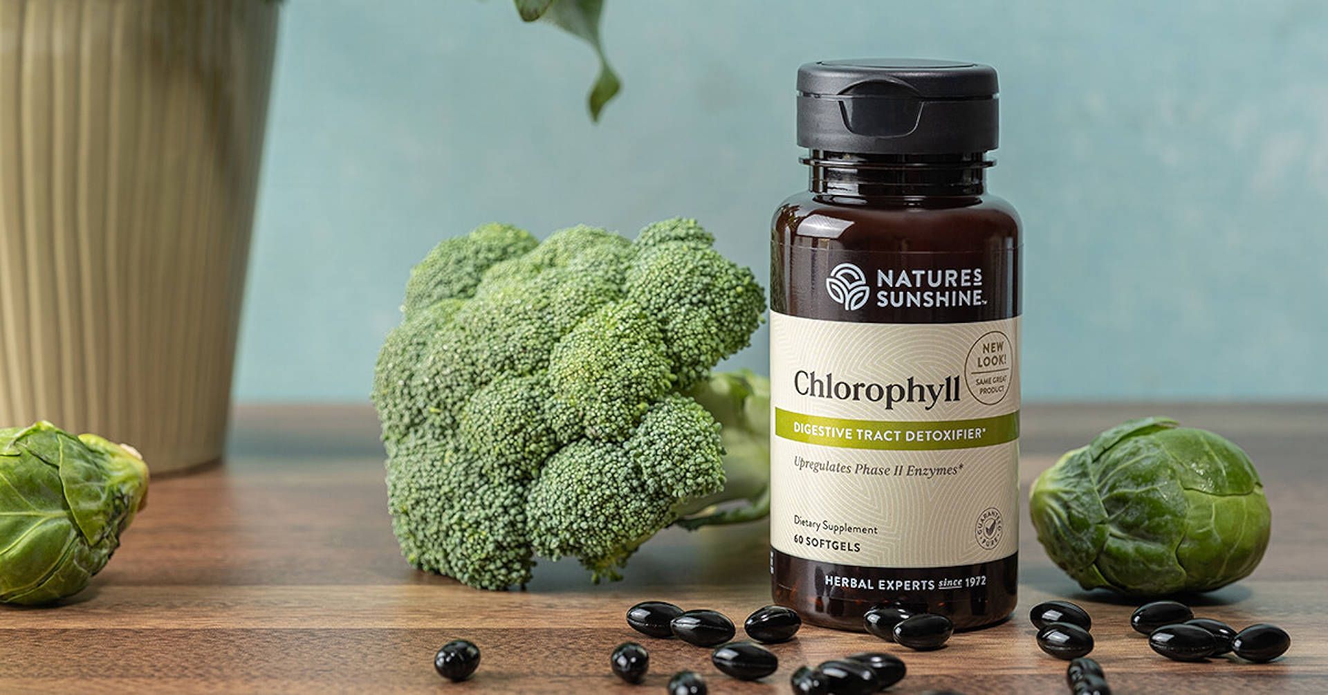 bottle of encapsulated chlorphyll and broccoli 