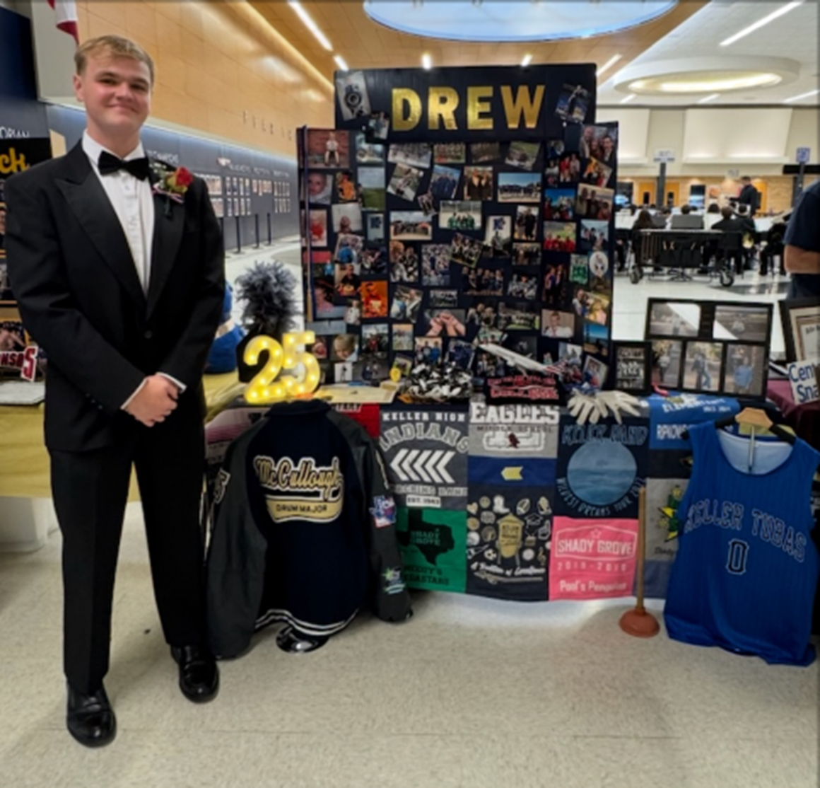 graduation male standing by his decorated table