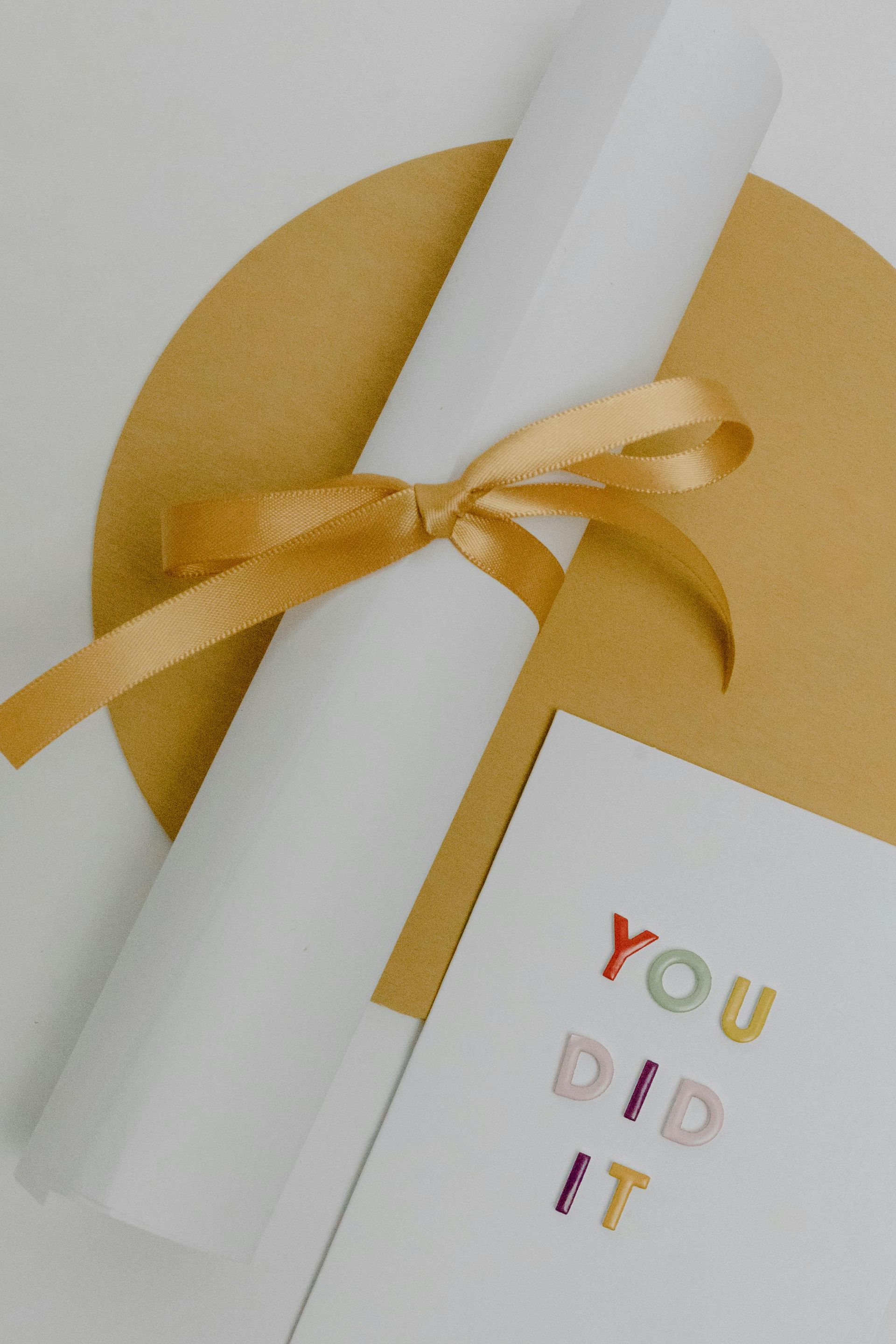 scroll with ribbon and 'you did it' 