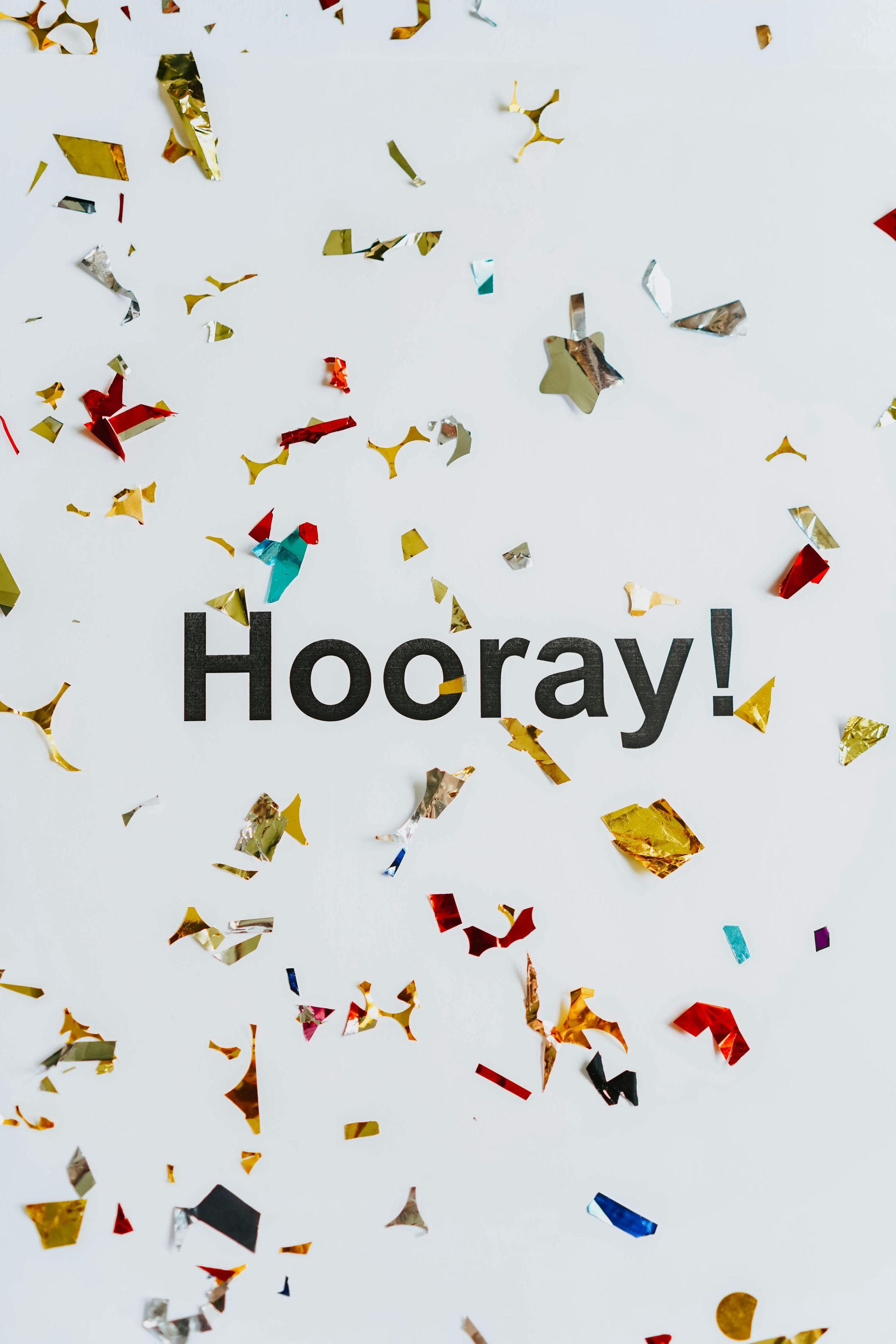 a colorful sheet of paper, with he word Hooray!