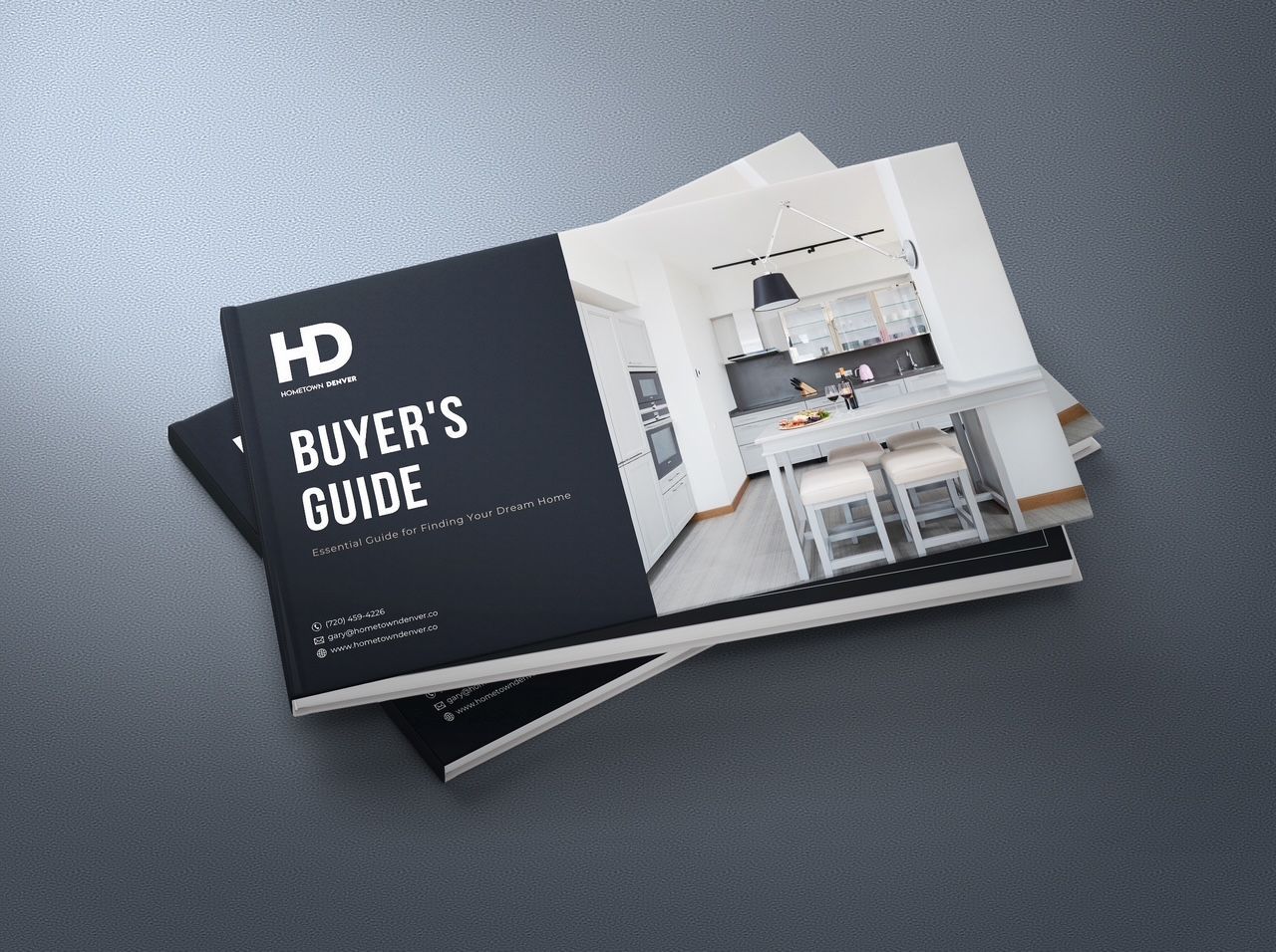 A buyer 's guide is stacked on top of each other on a table.