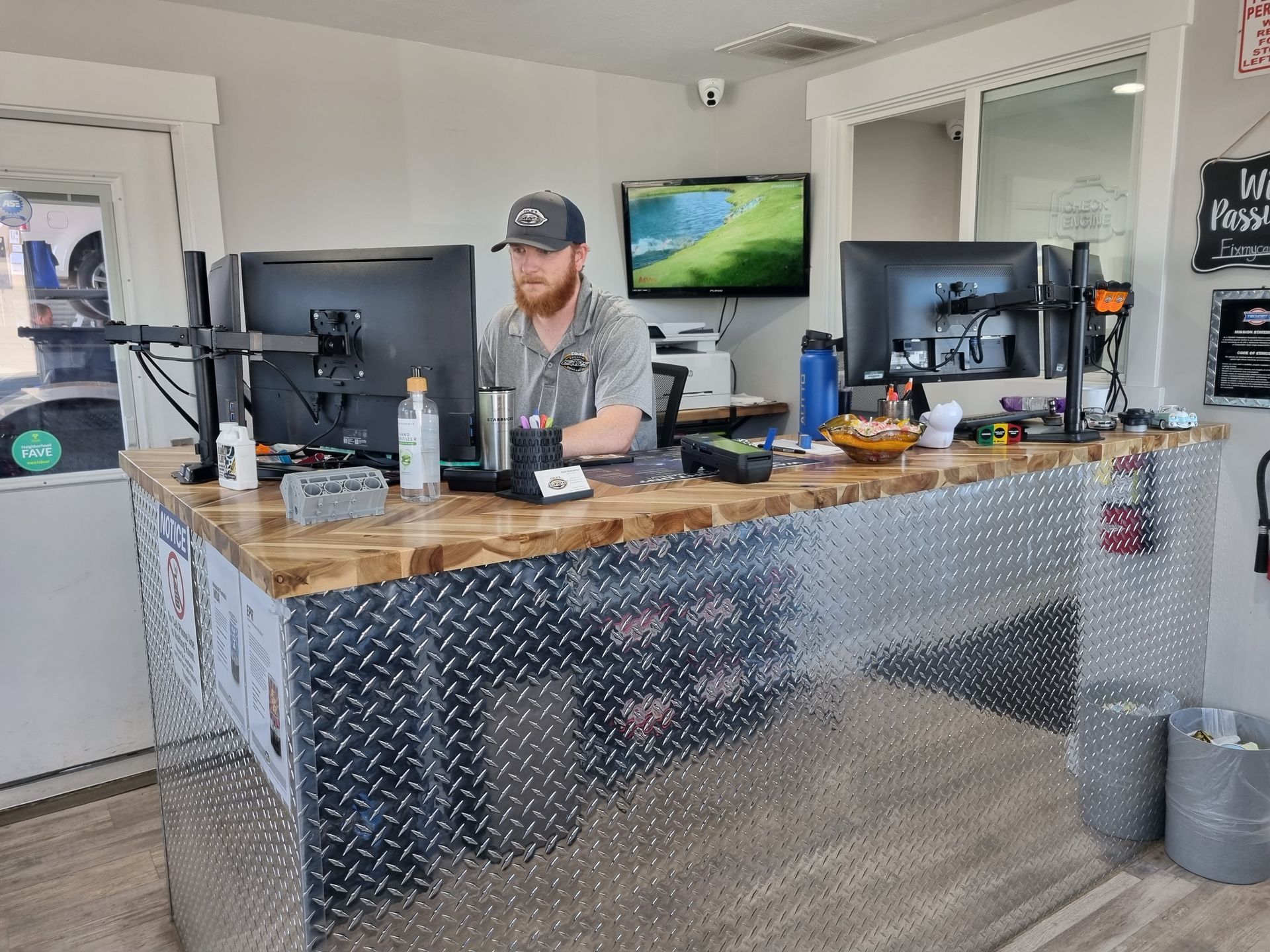 Staff Member Assisting Customer At Desk | Cole's Auto Repair & Service