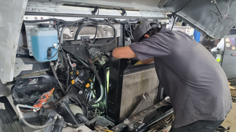 Mechanic Repairing Vehicle Engine | Cole's Auto Repair & Service