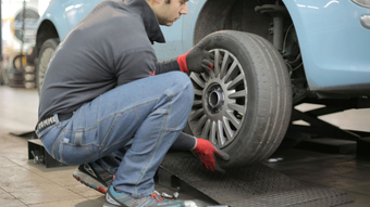 Mechanic Changing Front Tire | Cole's Auto Repair & Service