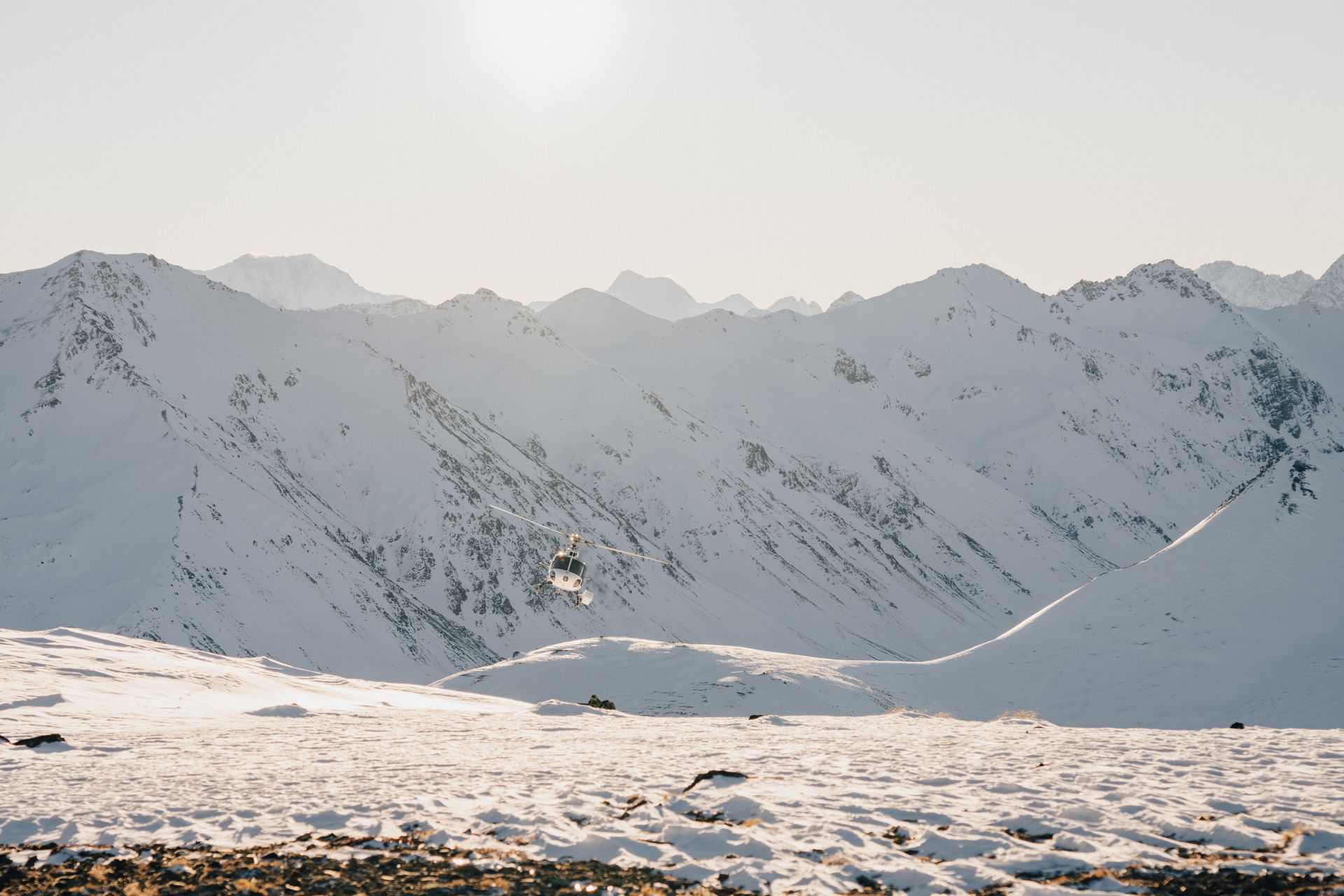A person is skiing down a snow covered mountain.