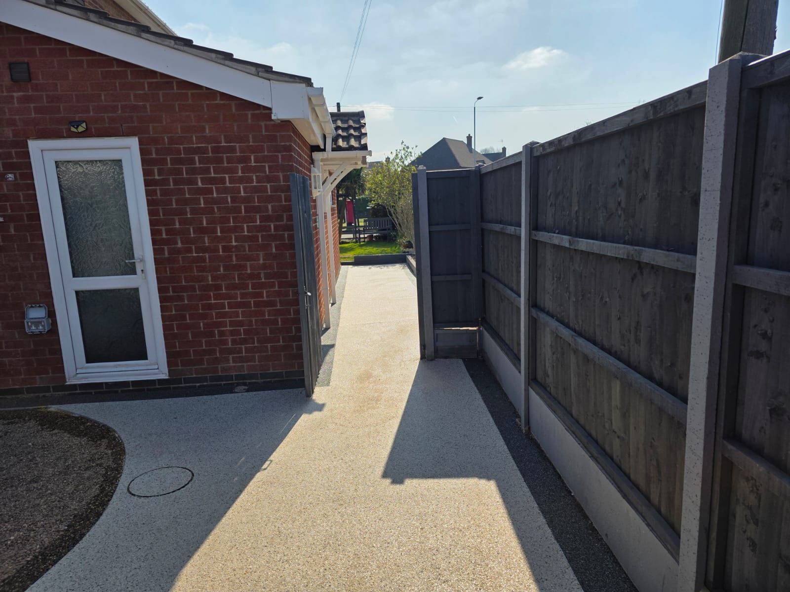 resin bound pathway round back of house with gate 