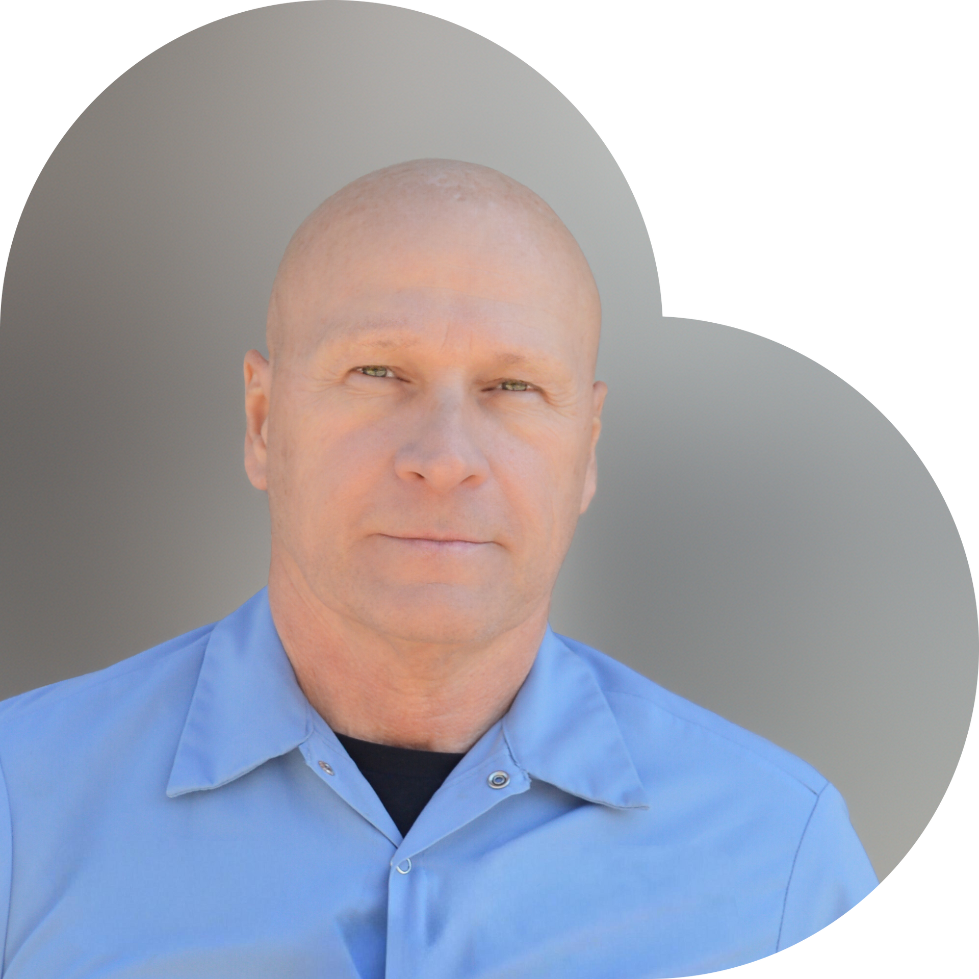 Man in a blue shirt, set against a grey heart-shaped background.